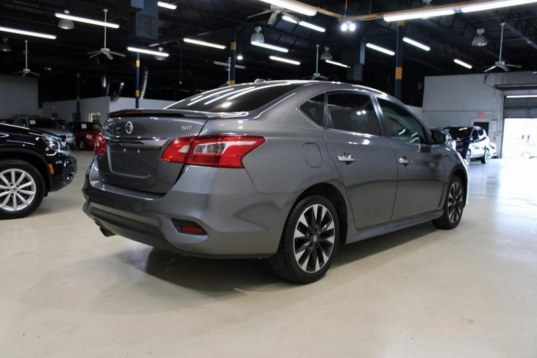 2019 Gun Metallic /Charcoal Nissan Sentra SR (3N1AB7AP0KY) with an 1.8L 4-Cylinder DOHC 16V engine, CVT transmission, located at 15300 Midway Rd., Addison, TX, 75001, (972) 702-0011, 32.958321, -96.838074 - HOME OF THE NO HAGGLE PRICE - WHOLESALE PRICES TO THE PUBLIC!! Sentra SR, 4D Sedan, 1.8L 4-Cylinder DOHC 16V, CVT with Xtronic, FWD, Gun Metallic, Charcoal Cloth.<br><br>Gun Metallic 2019 Nissan Sentra SR<br><br>Recent Arrival! 29/37 City/Highway MPG<br><br><br>At Midway Auto Group, we strive to pro - Photo #2
