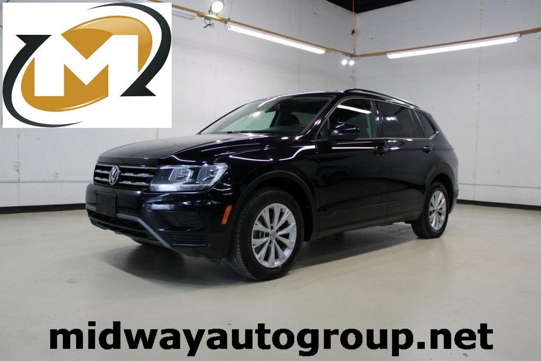 2019 Deep Black Pearl /Storm Gray Volkswagen Tiguan 2.0T S (3VV1B7AX6KM) with an 2.0L TSI DOHC engine, Automatic transmission, located at 15300 Midway Rd., Addison, TX, 75001, (972) 702-0011, 32.958321, -96.838074 - HOME OF THE NO HAGGLE PRICE - WHOLESALE PRICES TO THE PUBLIC!! Tiguan 2.0T S, 4D Sport Utility, 2.0L TSI DOHC, 8-Speed Automatic with Tiptronic, FWD, Black, Storm Gray Cloth.<br><br>Black 2019 Volkswagen Tiguan 2.0T S<br><br>22/29 City/Highway MPG<br><br><br>At Midway Auto Group, we strive to provid - Photo #0