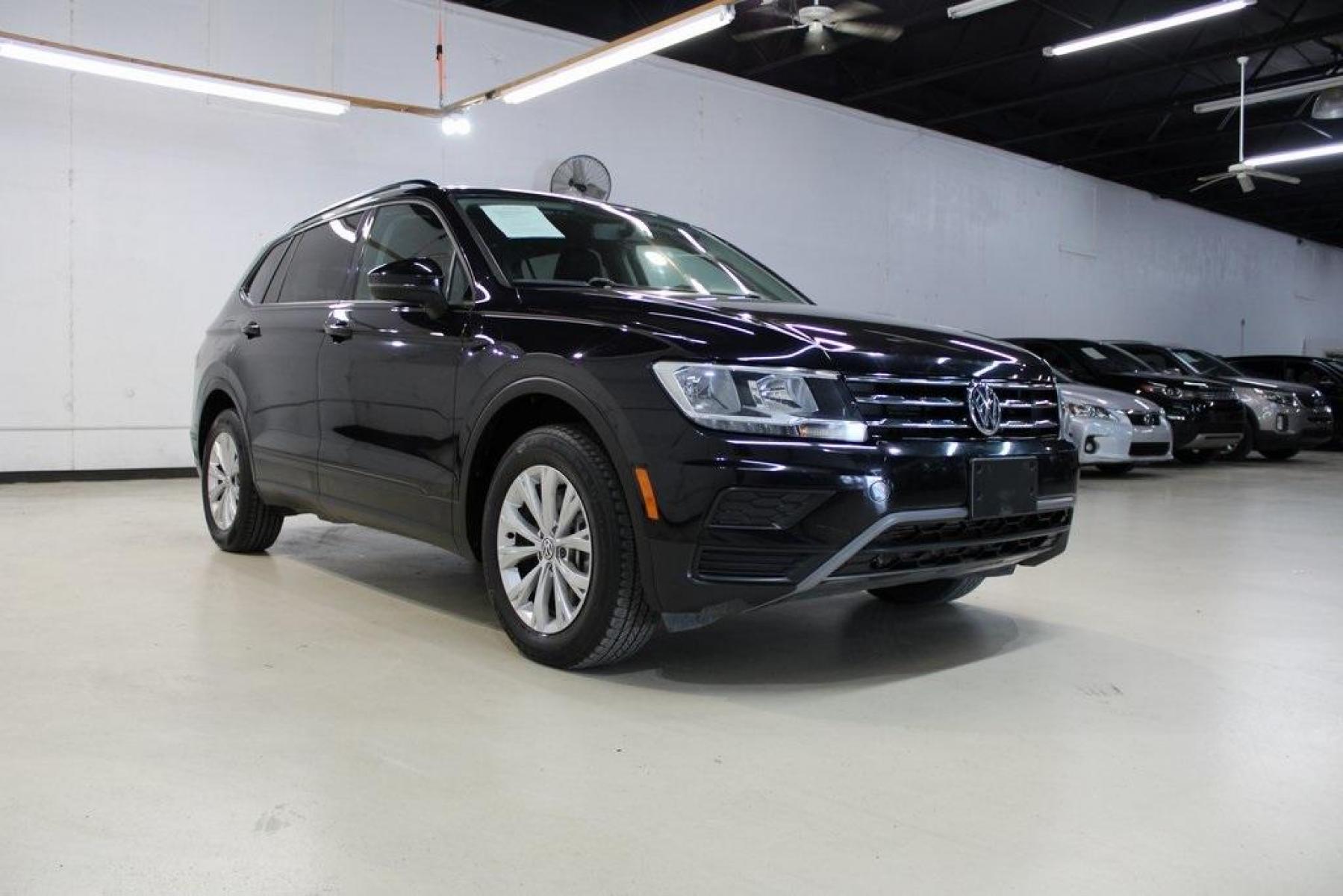 2019 Deep Black Pearl /Storm Gray Volkswagen Tiguan 2.0T S (3VV1B7AX6KM) with an 2.0L TSI DOHC engine, Automatic transmission, located at 15300 Midway Rd., Addison, TX, 75001, (972) 702-0011, 32.958321, -96.838074 - HOME OF THE NO HAGGLE PRICE - WHOLESALE PRICES TO THE PUBLIC!! Tiguan 2.0T S, 4D Sport Utility, 2.0L TSI DOHC, 8-Speed Automatic with Tiptronic, FWD, Black, Storm Gray Cloth.<br><br>Black 2019 Volkswagen Tiguan 2.0T S<br><br>22/29 City/Highway MPG<br><br><br>At Midway Auto Group, we strive to provid - Photo #1