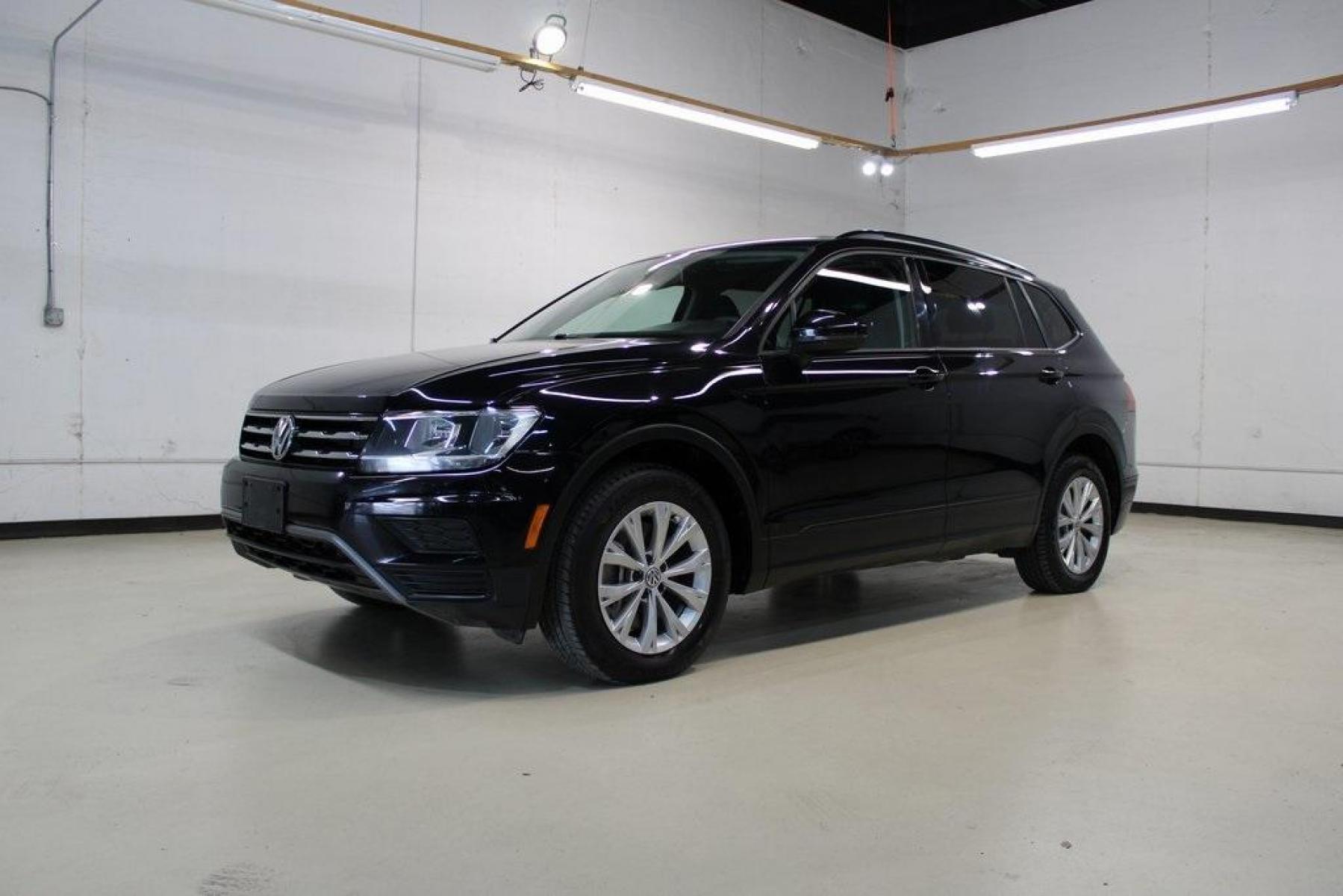 2019 Deep Black Pearl /Storm Gray Volkswagen Tiguan 2.0T S (3VV1B7AX6KM) with an 2.0L TSI DOHC engine, Automatic transmission, located at 15300 Midway Rd., Addison, TX, 75001, (972) 702-0011, 32.958321, -96.838074 - HOME OF THE NO HAGGLE PRICE - WHOLESALE PRICES TO THE PUBLIC!! Tiguan 2.0T S, 4D Sport Utility, 2.0L TSI DOHC, 8-Speed Automatic with Tiptronic, FWD, Black, Storm Gray Cloth.<br><br>Black 2019 Volkswagen Tiguan 2.0T S<br><br>22/29 City/Highway MPG<br><br><br>At Midway Auto Group, we strive to provid - Photo #4
