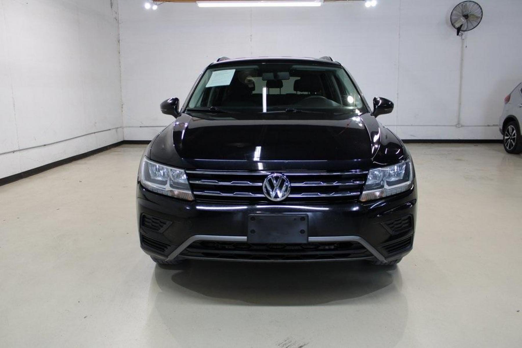 2019 Deep Black Pearl /Storm Gray Volkswagen Tiguan 2.0T S (3VV1B7AX6KM) with an 2.0L TSI DOHC engine, Automatic transmission, located at 15300 Midway Rd., Addison, TX, 75001, (972) 702-0011, 32.958321, -96.838074 - HOME OF THE NO HAGGLE PRICE - WHOLESALE PRICES TO THE PUBLIC!! Tiguan 2.0T S, 4D Sport Utility, 2.0L TSI DOHC, 8-Speed Automatic with Tiptronic, FWD, Black, Storm Gray Cloth.<br><br>Black 2019 Volkswagen Tiguan 2.0T S<br><br>22/29 City/Highway MPG<br><br><br>At Midway Auto Group, we strive to provid - Photo #5