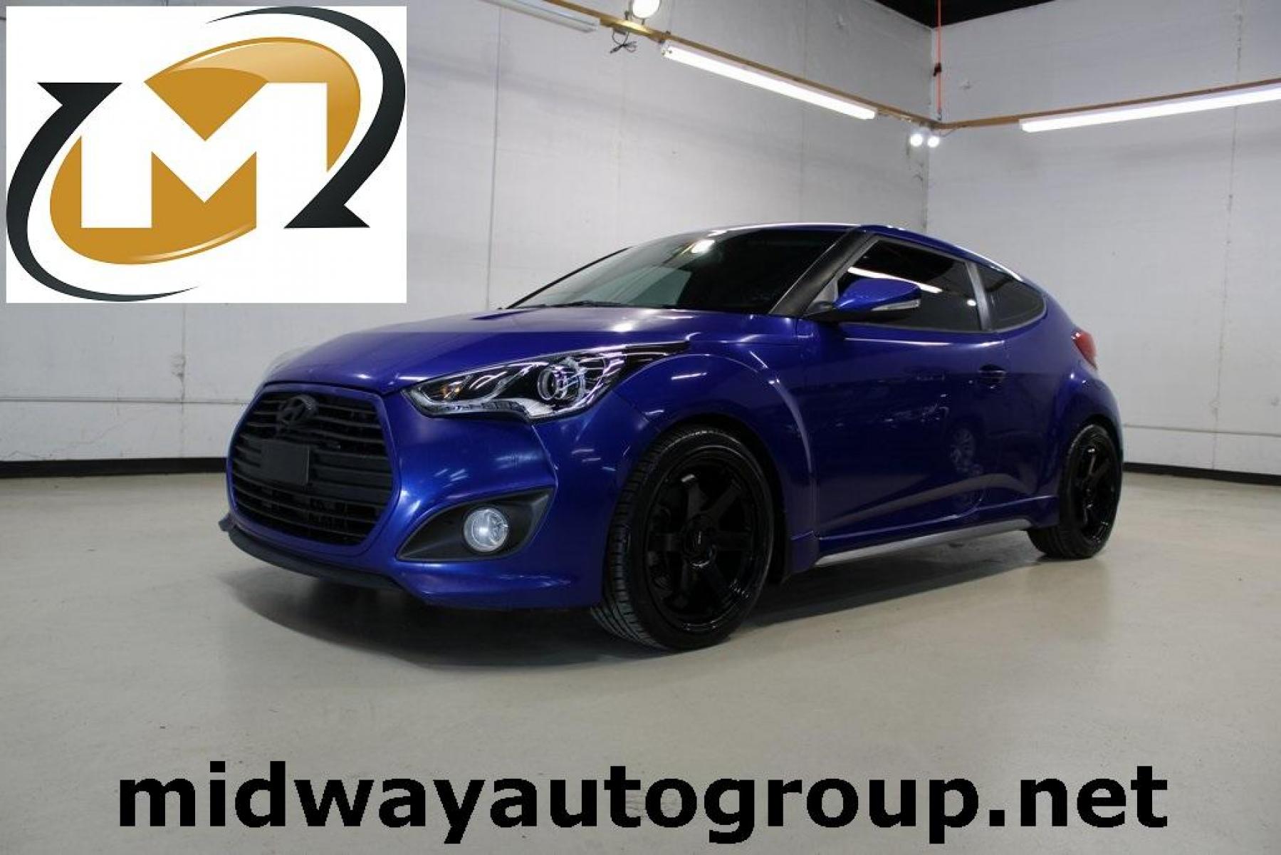 2014 Marathon Blue Pearl /Black Hyundai Veloster Turbo (KMHTC6AE7EU) with an 1.6L I4 DGI DOHC 16V Turbocharged engine, Manual transmission, located at 15300 Midway Rd., Addison, TX, 75001, (972) 702-0011, 32.958321, -96.838074 - HOME OF THE NO HAGGLE PRICE - WHOLESALE PRICES TO THE PUBLIC!! Veloster Turbo w/Black, 3D Hatchback, 1.6L I4 DGI DOHC 16V Turbocharged, 6-Speed Manual, FWD, Marathon Blue Pearl, Black Leather.<br><br>Marathon Blue Pearl 2014 Hyundai Veloster Turbo<br><br>Recent Arrival! 24/33 City/Highway MPG<br><br - Photo #0