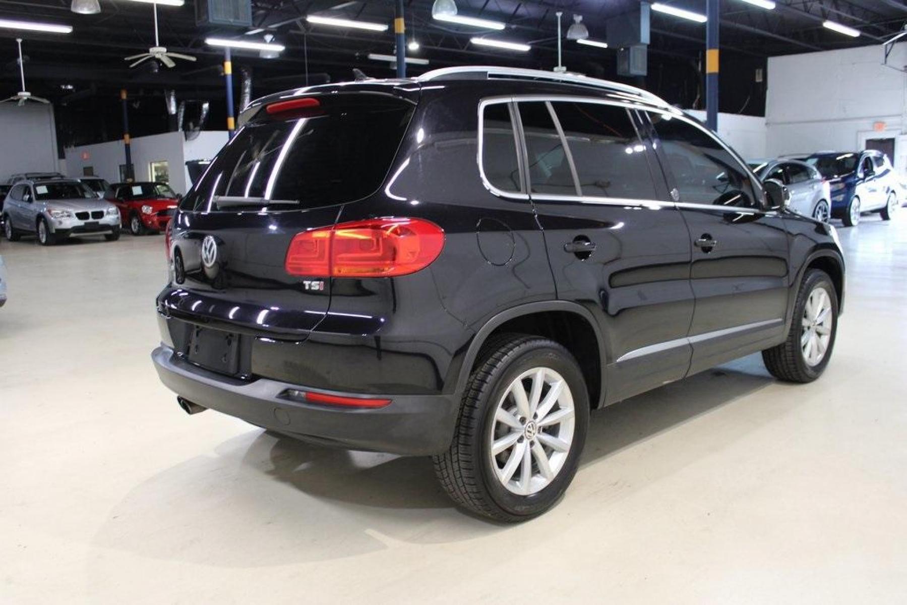 2017 Deep Black Pearl /Charcoal Black, Leat Volkswagen Tiguan Wolfsburg (WVGRV7AX4HW) with an 2.0L TSI DOHC engine, Automatic transmission, located at 15300 Midway Rd., Addison, TX, 75001, (972) 702-0011, 32.958321, -96.838074 - Photo #2