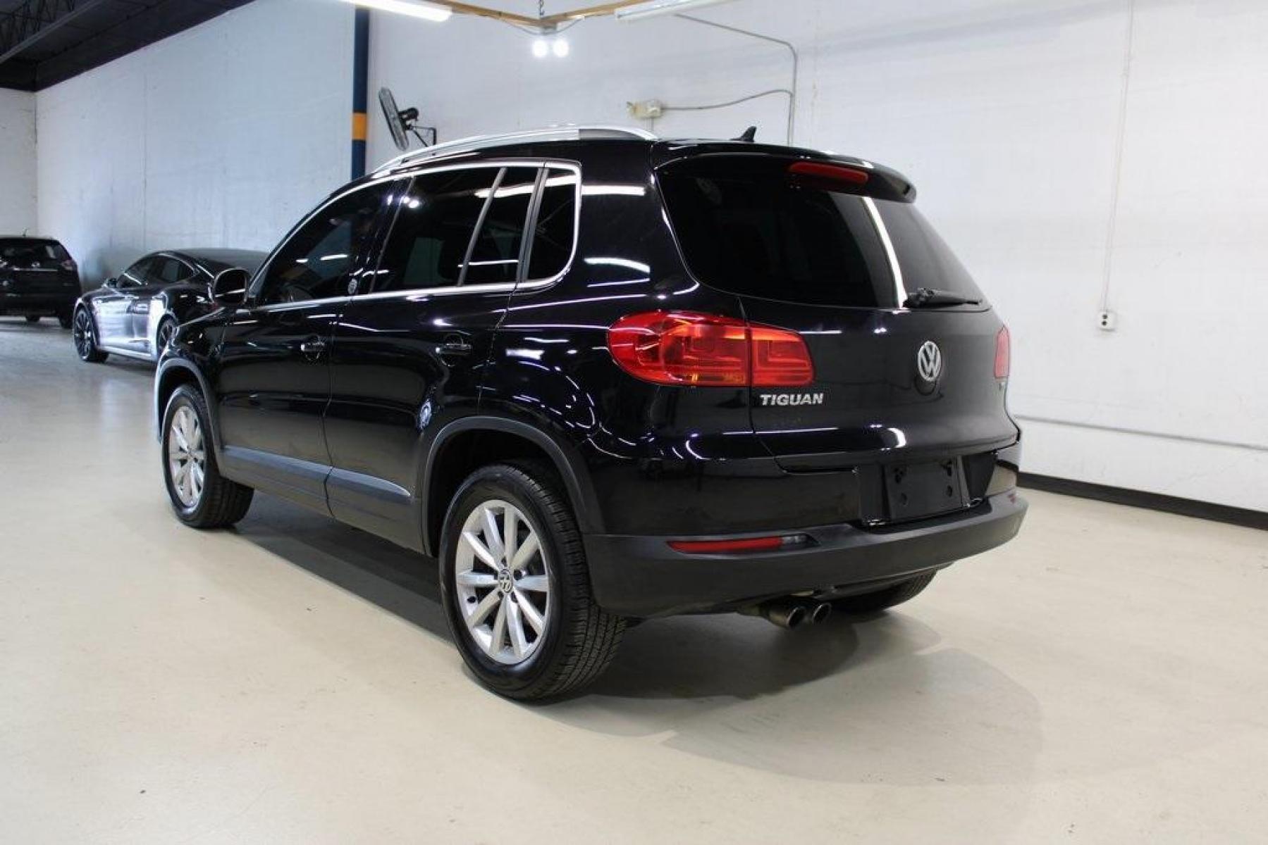 2017 Deep Black Pearl /Charcoal Black, Leat Volkswagen Tiguan Wolfsburg (WVGRV7AX4HW) with an 2.0L TSI DOHC engine, Automatic transmission, located at 15300 Midway Rd., Addison, TX, 75001, (972) 702-0011, 32.958321, -96.838074 - Photo #3