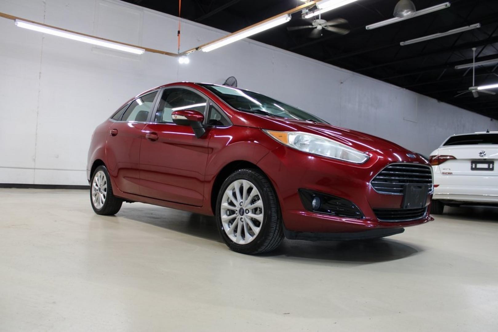 2017 Ruby Red Metallic Tinted Clearcoat Ford Fiesta Titanium (3FADP4CJ8HM) with an 1.6L I4 Ti-VCT engine, Automatic transmission, located at 15300 Midway Rd., Addison, TX, 75001, (972) 702-0011, 32.958321, -96.838074 - Photo#1