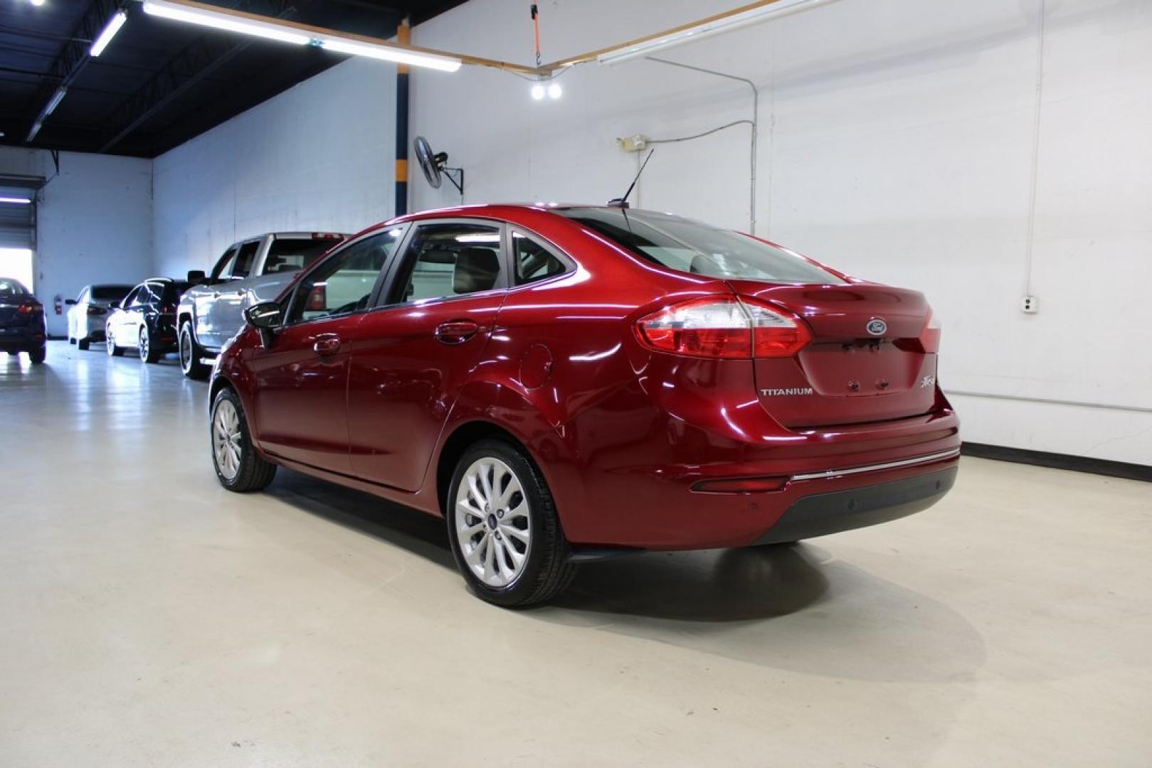 2017 Ruby Red Metallic Tinted Clearcoat Ford Fiesta Titanium (3FADP4CJ8HM) with an 1.6L I4 Ti-VCT engine, Automatic transmission, located at 15300 Midway Rd., Addison, TX, 75001, (972) 702-0011, 32.958321, -96.838074 - Photo#3