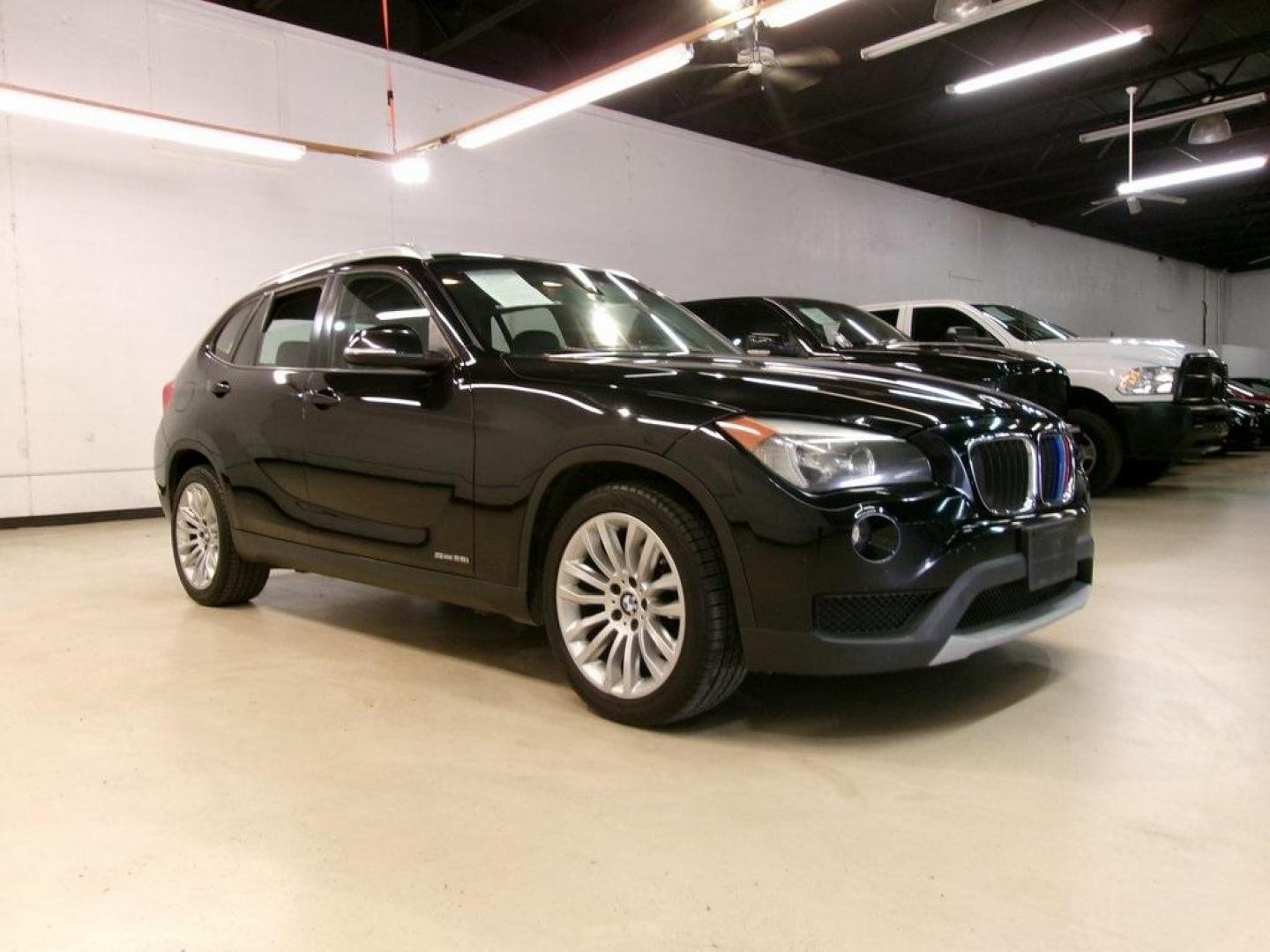 2014 Black Sapphire Metallic /Black BMW X1 sDrive28i (WBAVM1C55EV) with an 2.0L 4-Cylinder DOHC 16V TwinPower Turbo engine, Automatic transmission, located at 15300 Midway Rd., Addison, TX, 75001, (972) 702-0011, 32.958321, -96.838074 - HOME OF THE NO HAGGLE PRICE - WHOLESALE PRICES TO THE PUBLIC!! X1 sDrive28i, 4D Sport Utility, 2.0L 4-Cylinder DOHC 16V TwinPower Turbo, 8-Speed Automatic Steptronic, RWD, Black Sapphire Metallic, Black Artificial Leather.<br><br>Black Sapphire Metallic 2014 BMW X1 sDrive28i<br><br>23/34 City/Highwa - Photo#1