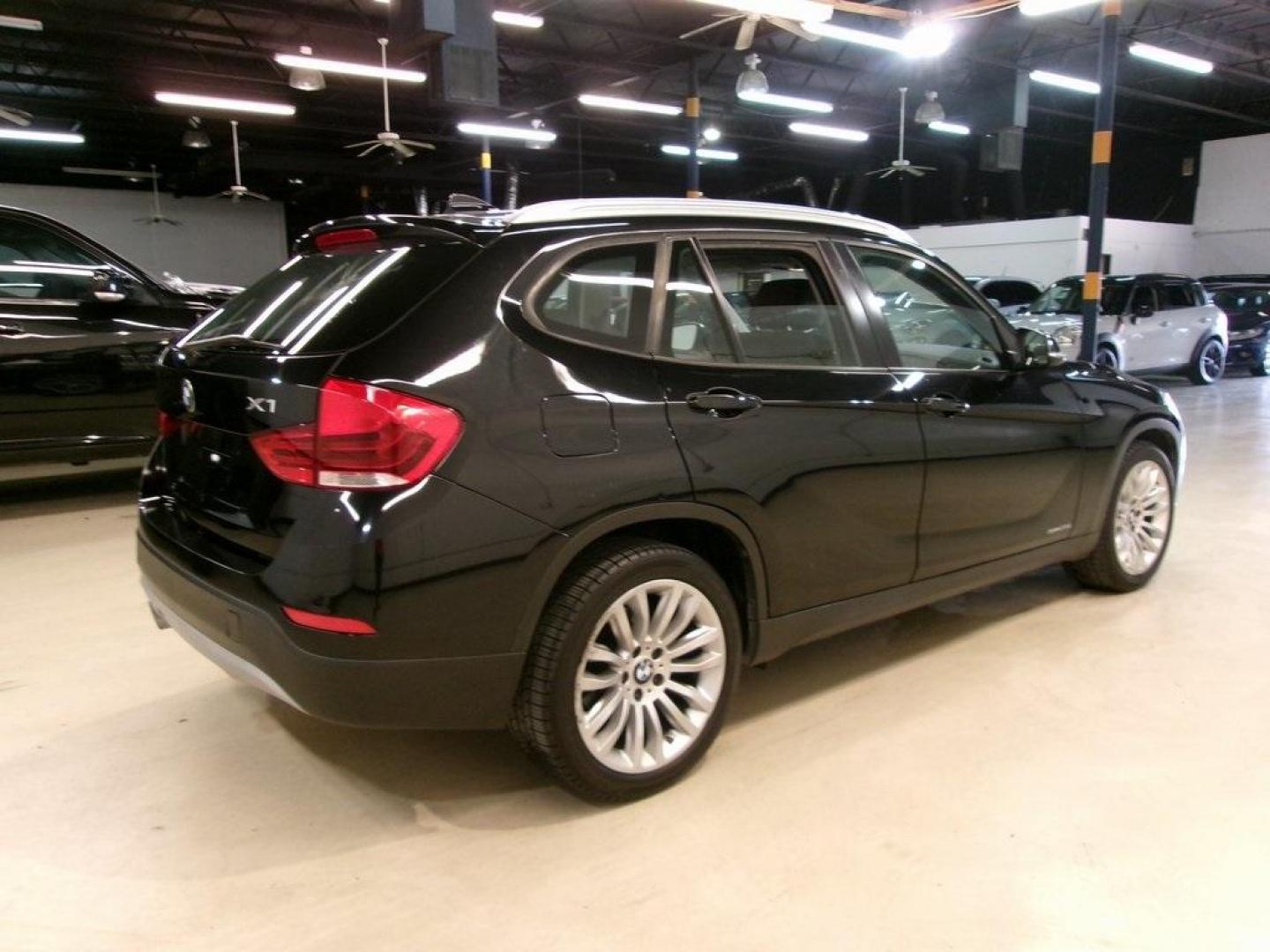 2014 Black Sapphire Metallic /Black BMW X1 sDrive28i (WBAVM1C55EV) with an 2.0L 4-Cylinder DOHC 16V TwinPower Turbo engine, Automatic transmission, located at 15300 Midway Rd., Addison, TX, 75001, (972) 702-0011, 32.958321, -96.838074 - HOME OF THE NO HAGGLE PRICE - WHOLESALE PRICES TO THE PUBLIC!! X1 sDrive28i, 4D Sport Utility, 2.0L 4-Cylinder DOHC 16V TwinPower Turbo, 8-Speed Automatic Steptronic, RWD, Black Sapphire Metallic, Black Artificial Leather.<br><br>Black Sapphire Metallic 2014 BMW X1 sDrive28i<br><br>23/34 City/Highwa - Photo#2