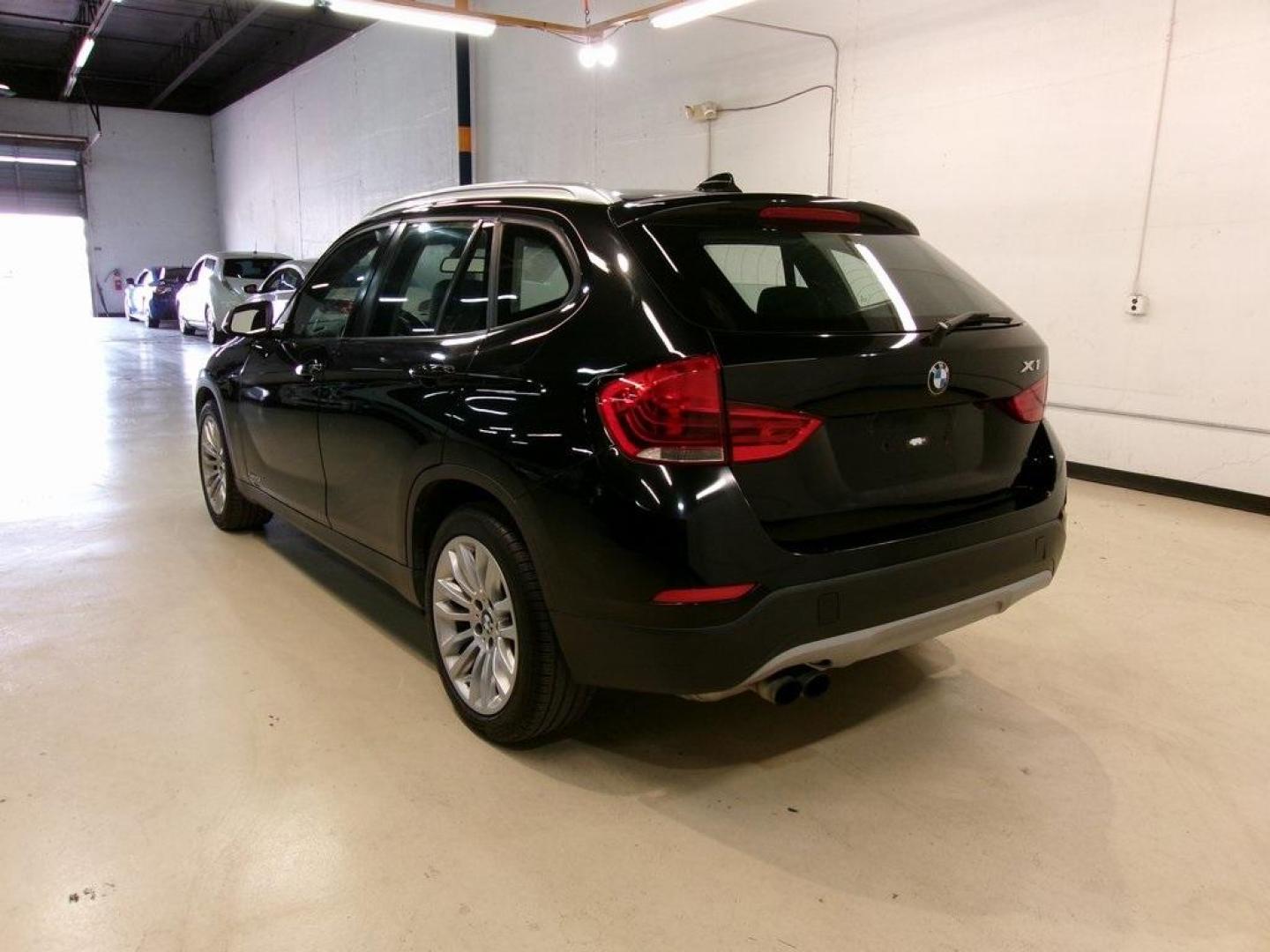 2014 Black Sapphire Metallic /Black BMW X1 sDrive28i (WBAVM1C55EV) with an 2.0L 4-Cylinder DOHC 16V TwinPower Turbo engine, Automatic transmission, located at 15300 Midway Rd., Addison, TX, 75001, (972) 702-0011, 32.958321, -96.838074 - HOME OF THE NO HAGGLE PRICE - WHOLESALE PRICES TO THE PUBLIC!! X1 sDrive28i, 4D Sport Utility, 2.0L 4-Cylinder DOHC 16V TwinPower Turbo, 8-Speed Automatic Steptronic, RWD, Black Sapphire Metallic, Black Artificial Leather.<br><br>Black Sapphire Metallic 2014 BMW X1 sDrive28i<br><br>23/34 City/Highwa - Photo#3