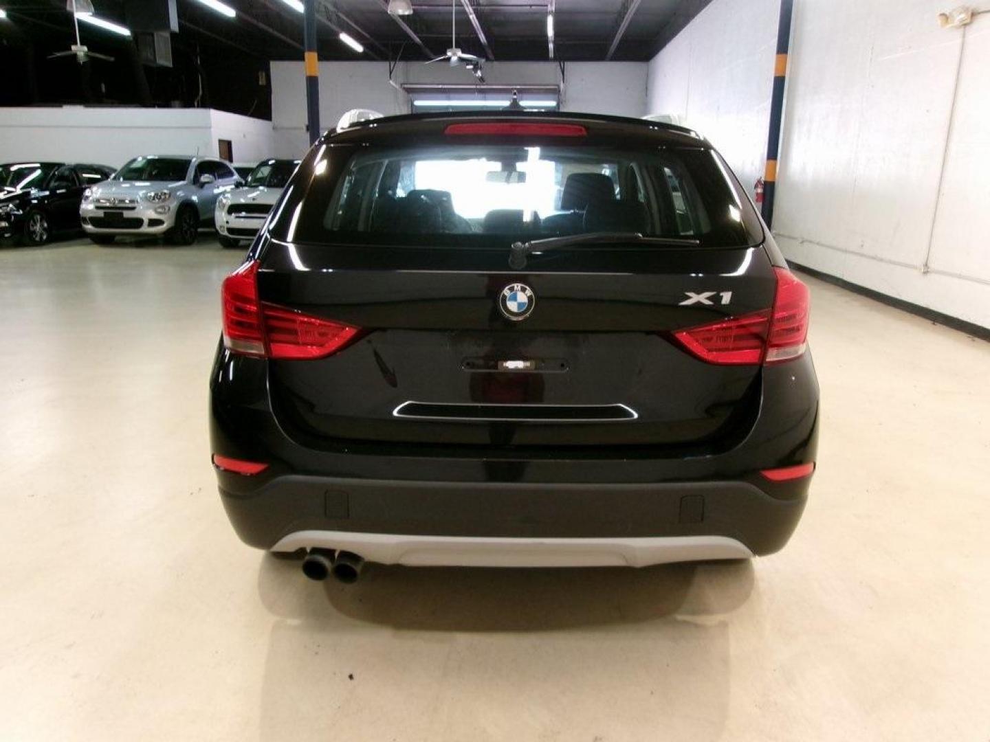 2014 Black Sapphire Metallic /Black BMW X1 sDrive28i (WBAVM1C55EV) with an 2.0L 4-Cylinder DOHC 16V TwinPower Turbo engine, Automatic transmission, located at 15300 Midway Rd., Addison, TX, 75001, (972) 702-0011, 32.958321, -96.838074 - HOME OF THE NO HAGGLE PRICE - WHOLESALE PRICES TO THE PUBLIC!! X1 sDrive28i, 4D Sport Utility, 2.0L 4-Cylinder DOHC 16V TwinPower Turbo, 8-Speed Automatic Steptronic, RWD, Black Sapphire Metallic, Black Artificial Leather.<br><br>Black Sapphire Metallic 2014 BMW X1 sDrive28i<br><br>23/34 City/Highwa - Photo#7