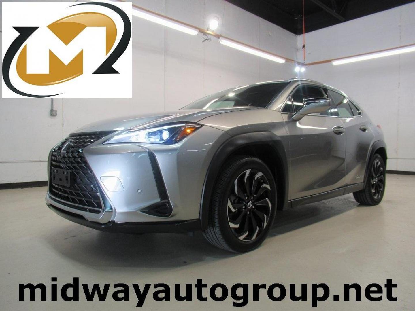 2021 Atomic Silver /Black Lexus UX 250h Base (JTHP9JBH5M2) with an 2.0L 16V DOHC engine, CVT transmission, located at 15300 Midway Rd., Addison, TX, 75001, (972) 702-0011, 32.958321, -96.838074 - HOME OF THE NO HAGGLE PRICE - WHOLESALE PRICES TO THE PUBLIC!! AWD, Bluetooth, Hands Free Connectivity, Navigation, Premium Audio, Backup Camera, Cruise Control, Keyless Entry, Power Locks, Power Windows, Heated Seats, Leather Seats, Premium Wheels, High Performance Tires, Sunroof / Moonroof, Power - Photo#0