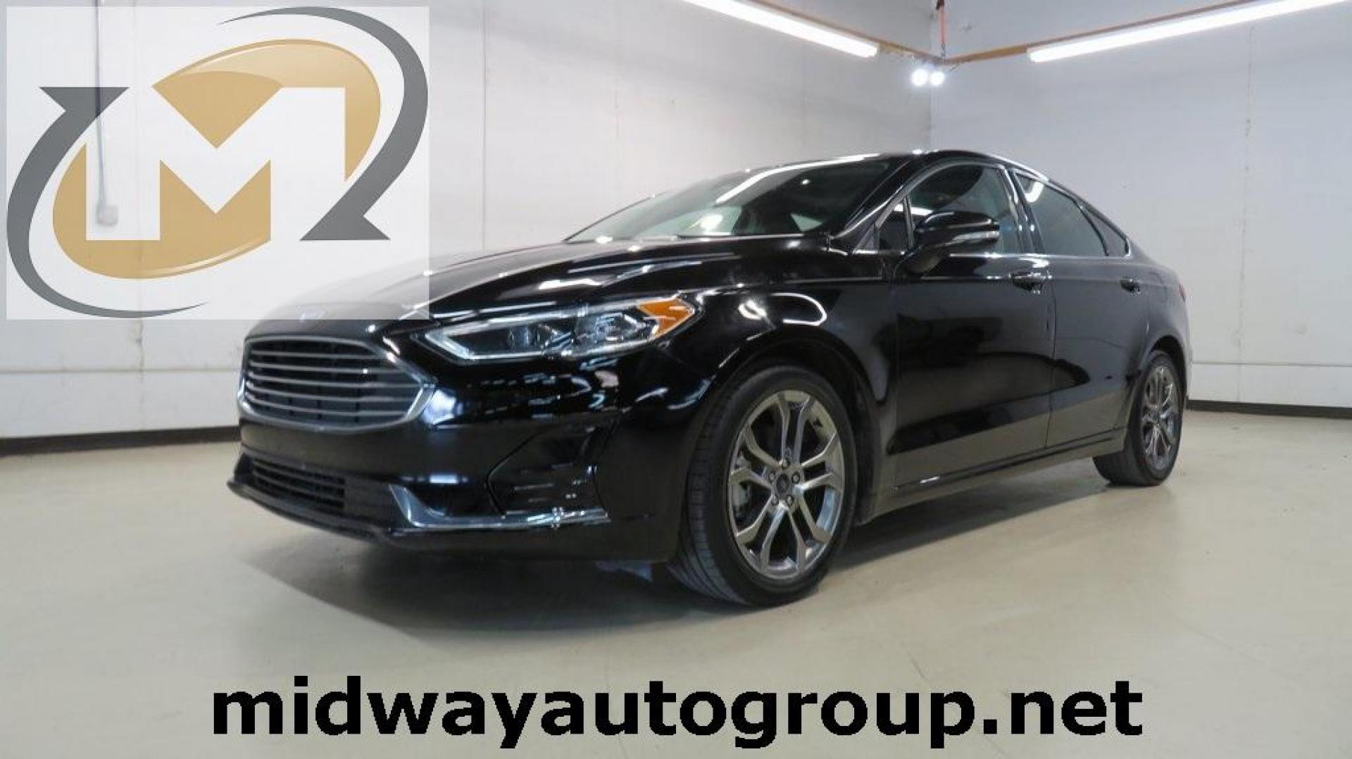 2020 Agate Black Metallic /Ebony Ford Fusion SEL (3FA6P0CD2LR) with an 1.5L EcoBoost engine, Automatic transmission, located at 15300 Midway Rd., Addison, TX, 75001, (972) 702-0011, 32.958321, -96.838074 - HOME OF THE NO HAGGLE PRICE - WHOLESALE PRICES TO THE PUBLIC!! Bluetooth, Hands Free Connectivity, Backup Camera, Leather Seats, Sunroof / Moonroof, NON SMOKER, Fusion SEL, 4D Sedan, 1.5L EcoBoost, 6-Speed Automatic, FWD, Black.<br><br>Black 2020 Ford Fusion SEL<br><br>23/34 City/Highway MPG<br><br> - Photo#0