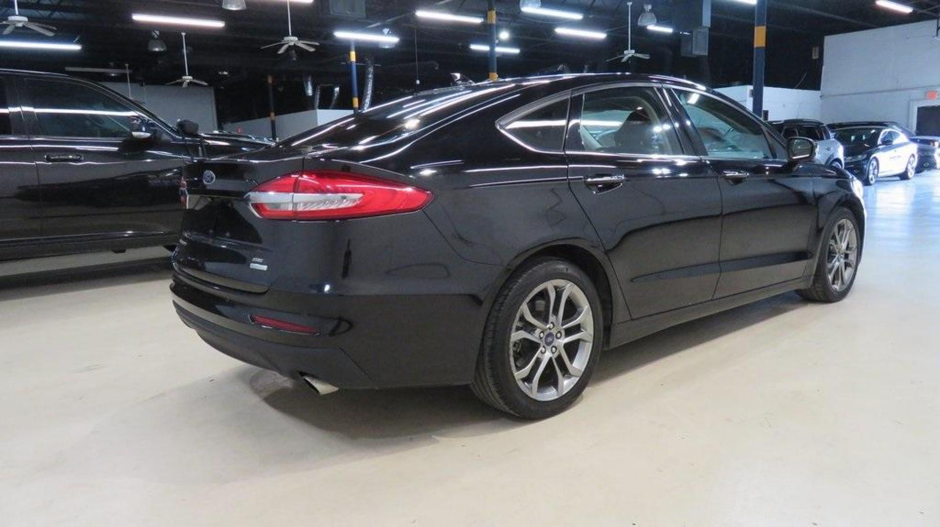 2020 Agate Black Metallic /Ebony Ford Fusion SEL (3FA6P0CD2LR) with an 1.5L EcoBoost engine, Automatic transmission, located at 15300 Midway Rd., Addison, TX, 75001, (972) 702-0011, 32.958321, -96.838074 - HOME OF THE NO HAGGLE PRICE - WHOLESALE PRICES TO THE PUBLIC!! Bluetooth, Hands Free Connectivity, Backup Camera, Leather Seats, Sunroof / Moonroof, NON SMOKER, Fusion SEL, 4D Sedan, 1.5L EcoBoost, 6-Speed Automatic, FWD, Black.<br><br>Black 2020 Ford Fusion SEL<br><br>23/34 City/Highway MPG<br><br> - Photo#2