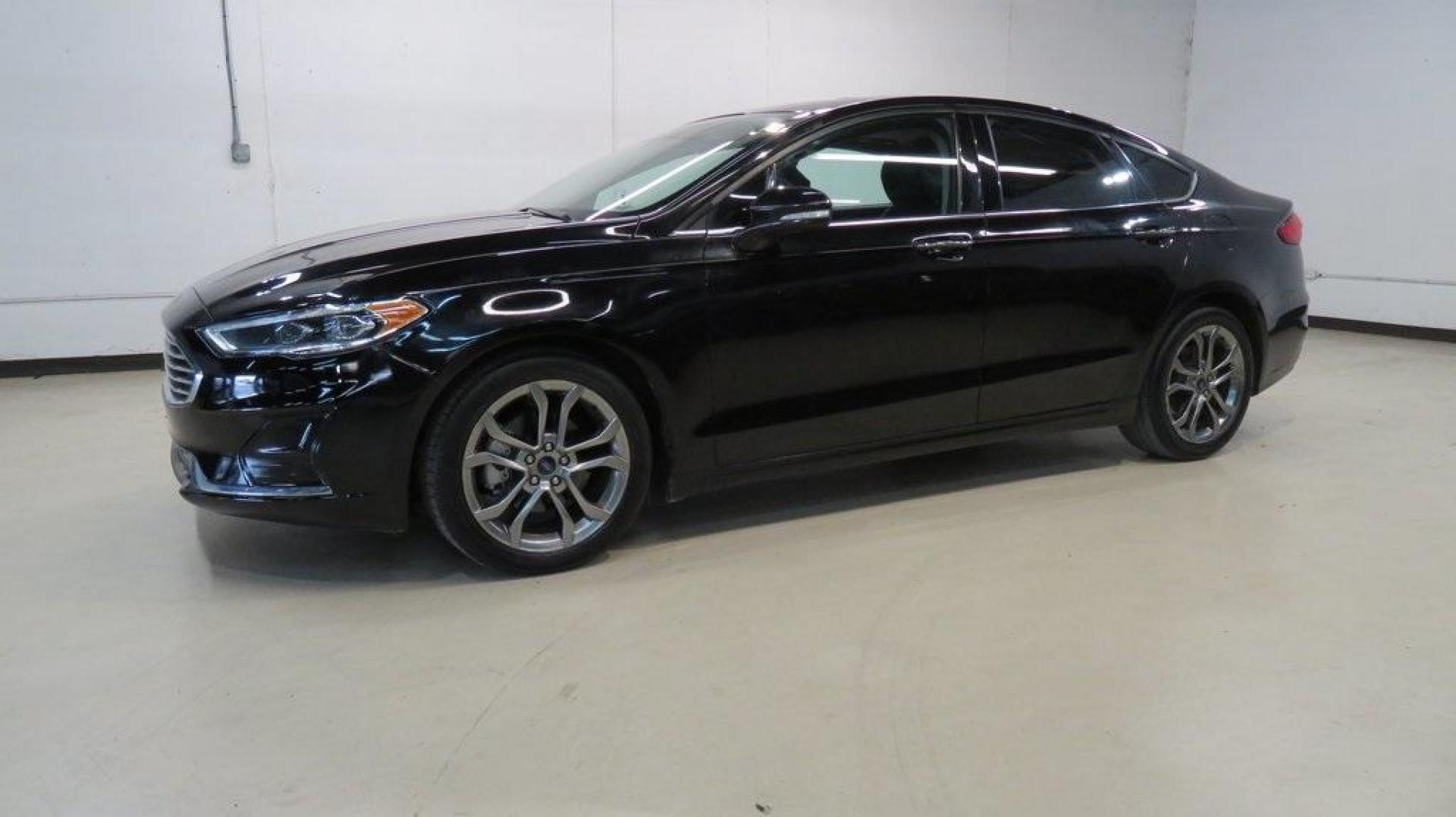 2020 Agate Black Metallic /Ebony Ford Fusion SEL (3FA6P0CD2LR) with an 1.5L EcoBoost engine, Automatic transmission, located at 15300 Midway Rd., Addison, TX, 75001, (972) 702-0011, 32.958321, -96.838074 - HOME OF THE NO HAGGLE PRICE - WHOLESALE PRICES TO THE PUBLIC!! Bluetooth, Hands Free Connectivity, Backup Camera, Leather Seats, Sunroof / Moonroof, NON SMOKER, Fusion SEL, 4D Sedan, 1.5L EcoBoost, 6-Speed Automatic, FWD, Black.<br><br>Black 2020 Ford Fusion SEL<br><br>23/34 City/Highway MPG<br><br> - Photo#4