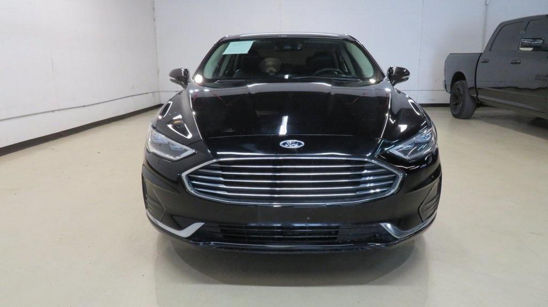 2020 Agate Black Metallic /Ebony Ford Fusion SEL (3FA6P0CD2LR) with an 1.5L EcoBoost engine, Automatic transmission, located at 15300 Midway Rd., Addison, TX, 75001, (972) 702-0011, 32.958321, -96.838074 - HOME OF THE NO HAGGLE PRICE - WHOLESALE PRICES TO THE PUBLIC!! Bluetooth, Hands Free Connectivity, Backup Camera, Leather Seats, Sunroof / Moonroof, NON SMOKER, Fusion SEL, 4D Sedan, 1.5L EcoBoost, 6-Speed Automatic, FWD, Black.<br><br>Black 2020 Ford Fusion SEL<br><br>23/34 City/Highway MPG<br><br> - Photo#5