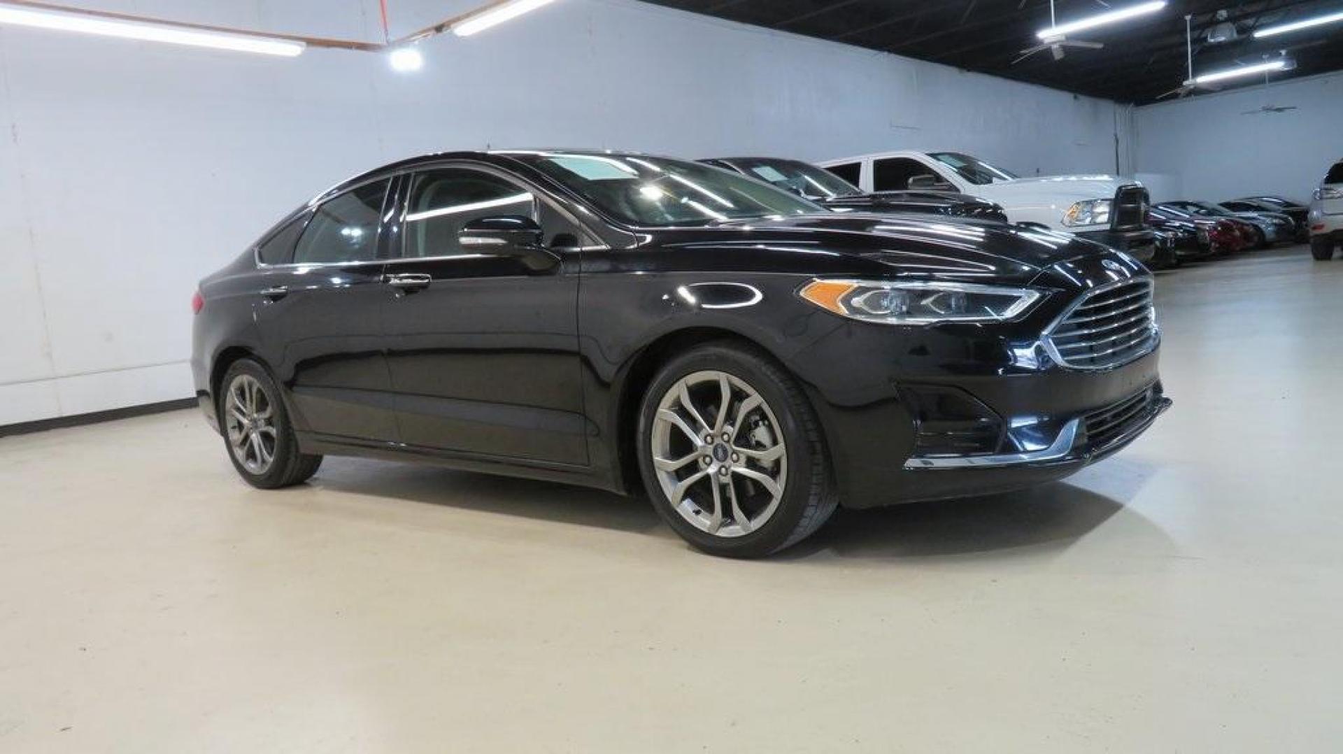 2020 Agate Black Metallic /Ebony Ford Fusion SEL (3FA6P0CD2LR) with an 1.5L EcoBoost engine, Automatic transmission, located at 15300 Midway Rd., Addison, TX, 75001, (972) 702-0011, 32.958321, -96.838074 - HOME OF THE NO HAGGLE PRICE - WHOLESALE PRICES TO THE PUBLIC!! Bluetooth, Hands Free Connectivity, Backup Camera, Leather Seats, Sunroof / Moonroof, NON SMOKER, Fusion SEL, 4D Sedan, 1.5L EcoBoost, 6-Speed Automatic, FWD, Black.<br><br>Black 2020 Ford Fusion SEL<br><br>23/34 City/Highway MPG<br><br> - Photo#6