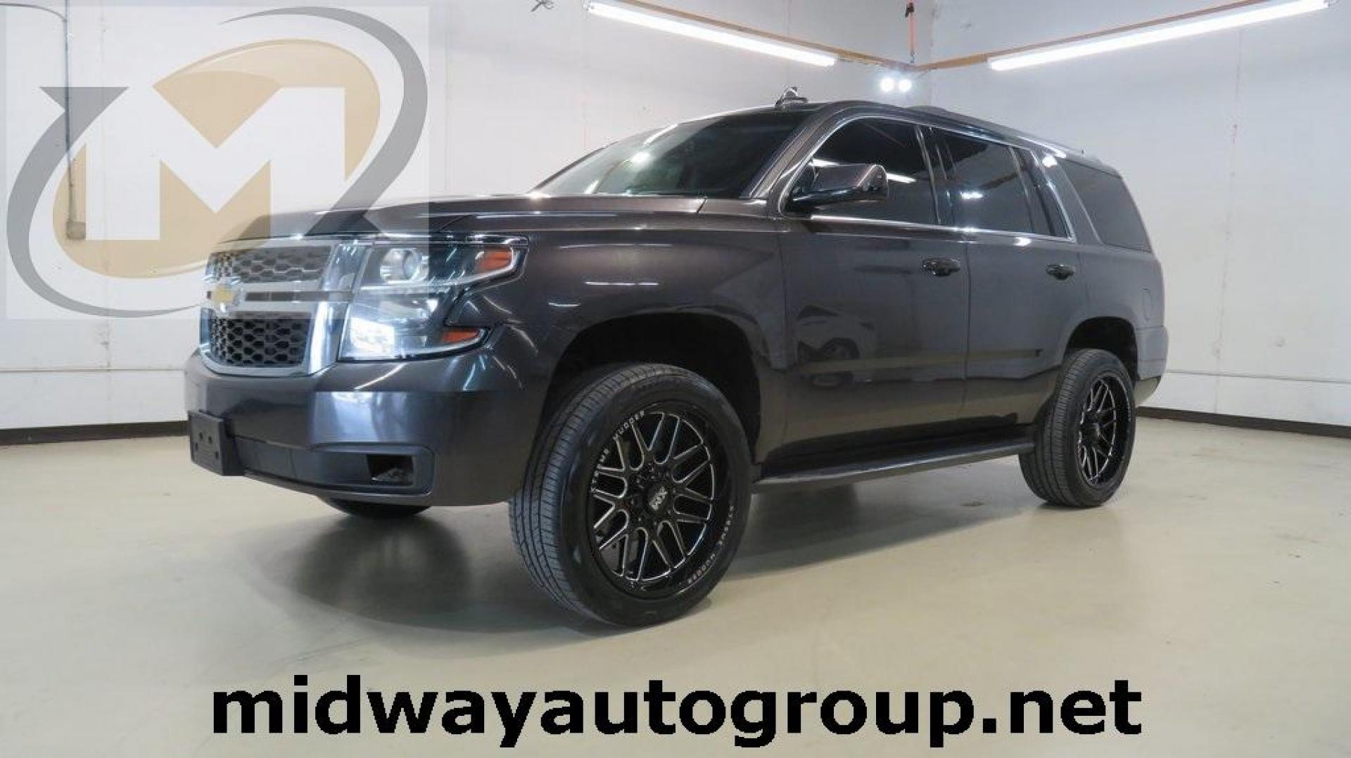 2017 Tungsten Metallic /Black Chevrolet Tahoe LT (1GNSKBKC2HR) with an EcoTec3 5.3L V8 engine, Automatic transmission, located at 15300 Midway Rd., Addison, TX, 75001, (972) 702-0011, 32.958321, -96.838074 - HOME OF THE NO HAGGLE PRICE - WHOLESALE PRICES TO THE PUBLIC!! Tahoe LT, 4D Sport Utility, EcoTec3 5.3L V8, 6-Speed Automatic Electronic with Overdrive, 4WD, Tungsten Metallic, Black Leather, Navigation System.<br><br>Tungsten Metallic 2017 Chevrolet Tahoe LT<br><br><br>Awards:<br> * JD Power Autom - Photo#0