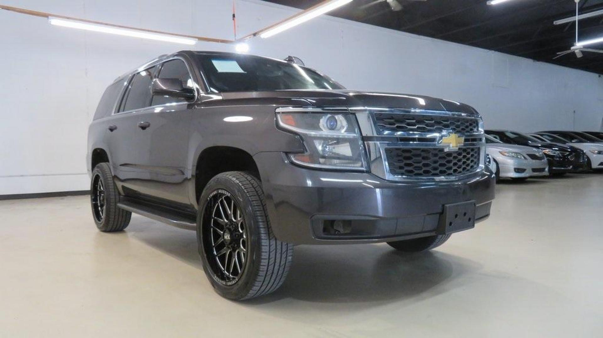 2017 Tungsten Metallic /Black Chevrolet Tahoe LT (1GNSKBKC2HR) with an EcoTec3 5.3L V8 engine, Automatic transmission, located at 15300 Midway Rd., Addison, TX, 75001, (972) 702-0011, 32.958321, -96.838074 - HOME OF THE NO HAGGLE PRICE - WHOLESALE PRICES TO THE PUBLIC!! Tahoe LT, 4D Sport Utility, EcoTec3 5.3L V8, 6-Speed Automatic Electronic with Overdrive, 4WD, Tungsten Metallic, Black Leather, Navigation System.<br><br>Tungsten Metallic 2017 Chevrolet Tahoe LT<br><br><br>Awards:<br> * JD Power Autom - Photo#1