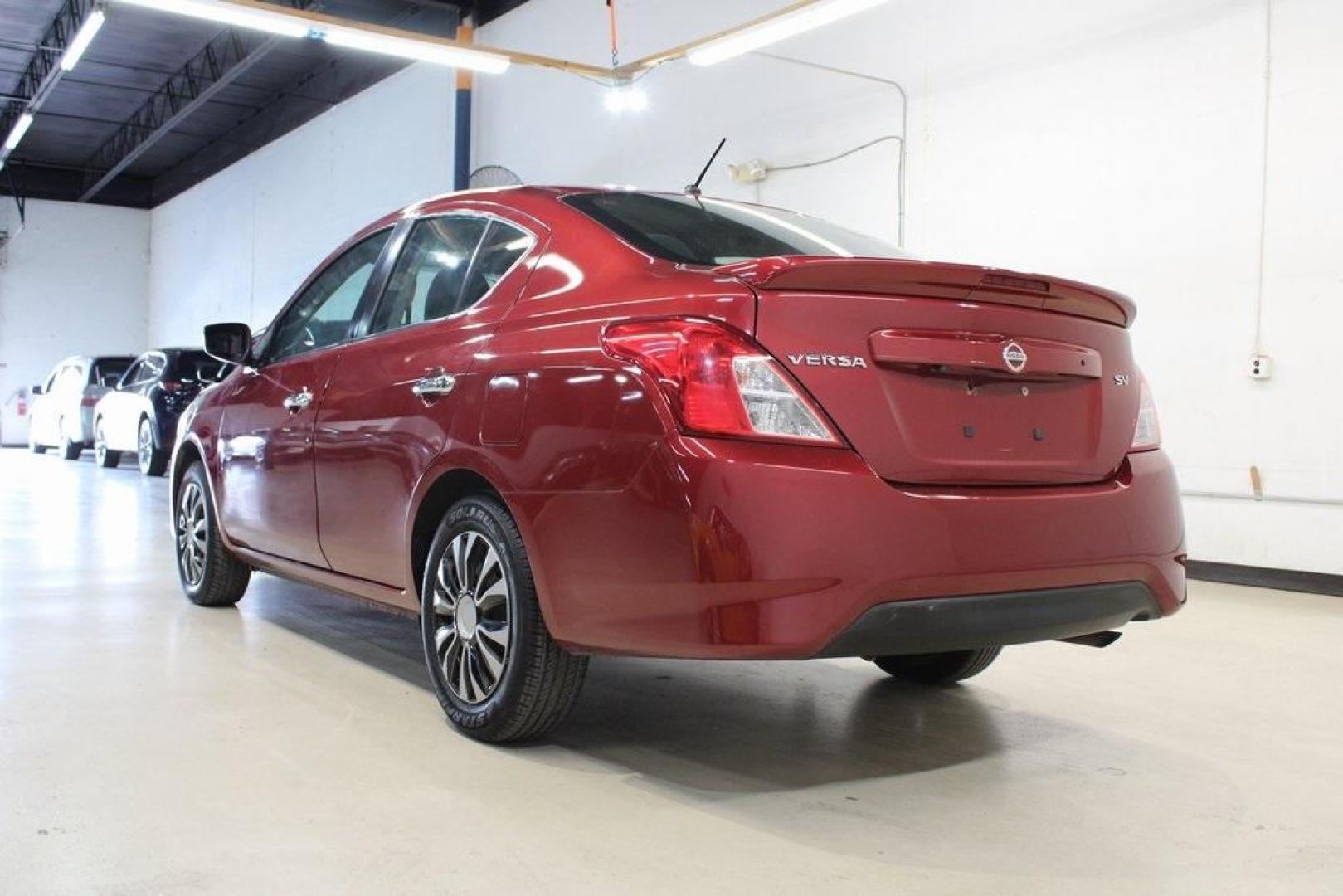 2019 Cayenne Red Metallic /Charcoal Nissan Versa 1.6 SV (3N1CN7APXKL) with an 1.6L 4-Cylinder DOHC 16V engine, CVT transmission, located at 15300 Midway Rd., Addison, TX, 75001, (972) 702-0011, 32.958321, -96.838074 - HOME OF THE NO HAGGLE PRICE - WHOLESALE PRICES TO THE PUBLIC!! Versa 1.6 SV, 4D Sedan, 1.6L 4-Cylinder DOHC 16V, CVT with Xtronic, FWD, Cayenne Red Metallic, Charcoal Cloth.<br><br>Cayenne Red Metallic 2019 Nissan Versa 1.6 SV<br><br>Recent Arrival! 31/39 City/Highway MPG<br><br><br>At Midway Auto G - Photo#3