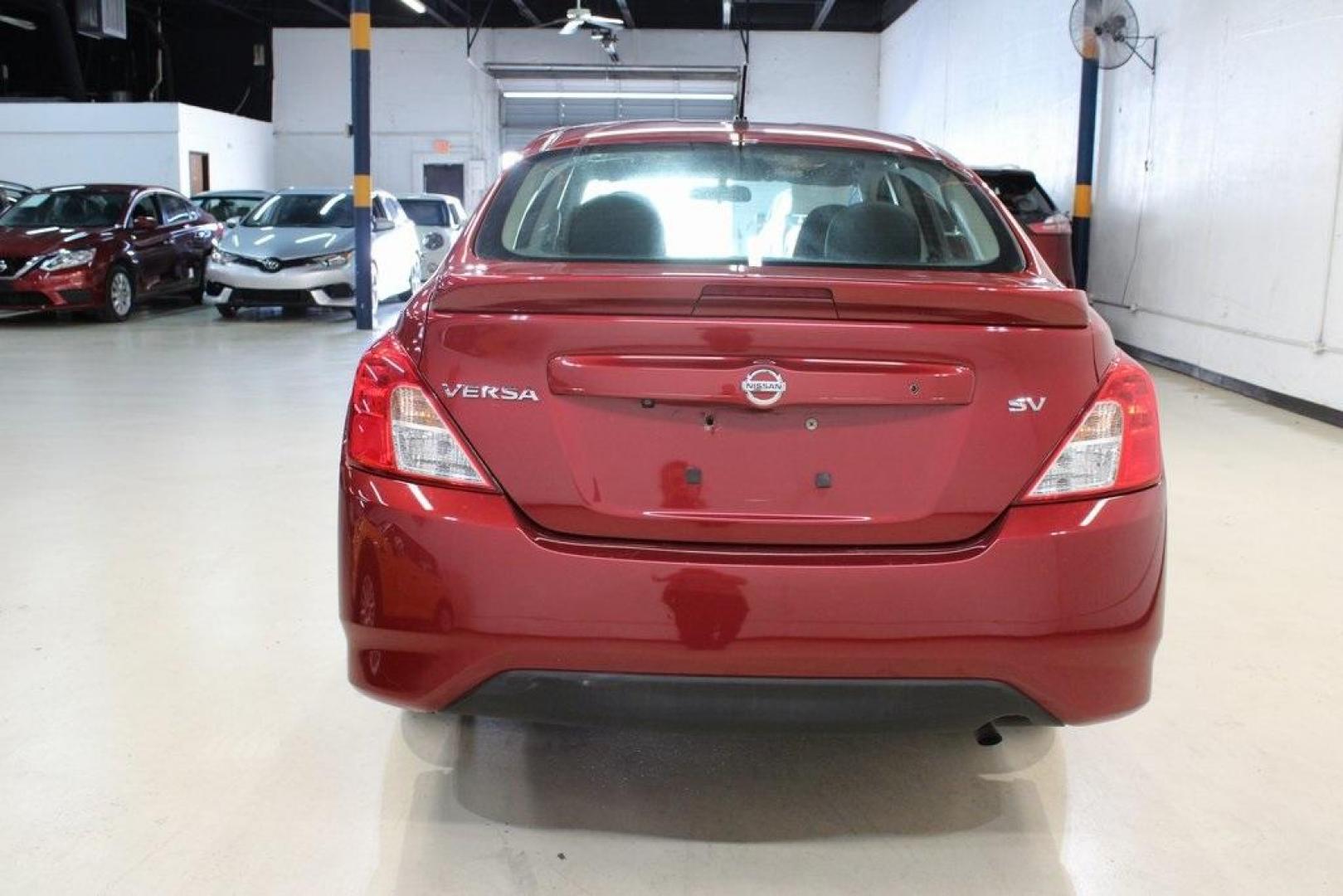 2019 Cayenne Red Metallic /Charcoal Nissan Versa 1.6 SV (3N1CN7APXKL) with an 1.6L 4-Cylinder DOHC 16V engine, CVT transmission, located at 15300 Midway Rd., Addison, TX, 75001, (972) 702-0011, 32.958321, -96.838074 - HOME OF THE NO HAGGLE PRICE - WHOLESALE PRICES TO THE PUBLIC!! Versa 1.6 SV, 4D Sedan, 1.6L 4-Cylinder DOHC 16V, CVT with Xtronic, FWD, Cayenne Red Metallic, Charcoal Cloth.<br><br>Cayenne Red Metallic 2019 Nissan Versa 1.6 SV<br><br>Recent Arrival! 31/39 City/Highway MPG<br><br><br>At Midway Auto G - Photo#7