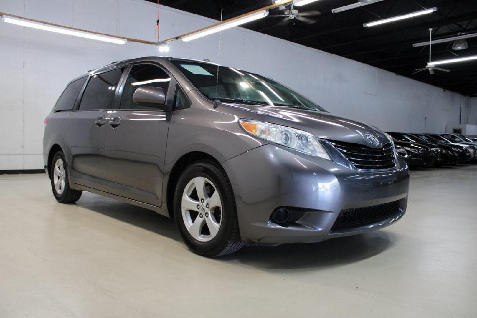 2014 Predawn Gray Mica /Light Gray Toyota Sienna LE (5TDKK3DC1ES) with an 3.5L V6 SMPI DOHC engine, Automatic transmission, located at 15300 Midway Rd., Addison, TX, 75001, (972) 702-0011, 32.958321, -96.838074 - HOME OF THE NO HAGGLE PRICE - WHOLESALE PRICES TO THE PUBLIC!! Sienna LE 8 Passenger, 4D Passenger Van, 3.5L V6 SMPI DOHC, 6-Speed Automatic Electronic with Overdrive, FWD, Gray, Light Gray Cloth.<br><br>Gray 2014 Toyota Sienna LE<br><br><br>Awards:<br> * 2014 KBB.com 12 Best Family Cars * 2014 K - Photo#1