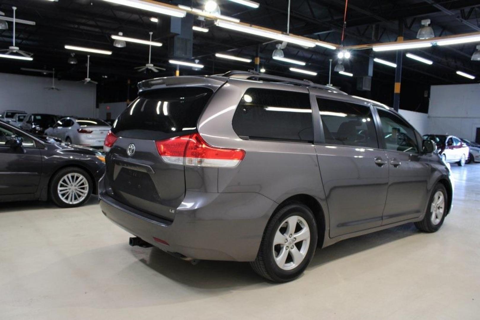 2014 Predawn Gray Mica /Light Gray Toyota Sienna LE (5TDKK3DC1ES) with an 3.5L V6 SMPI DOHC engine, Automatic transmission, located at 15300 Midway Rd., Addison, TX, 75001, (972) 702-0011, 32.958321, -96.838074 - HOME OF THE NO HAGGLE PRICE - WHOLESALE PRICES TO THE PUBLIC!! Sienna LE 8 Passenger, 4D Passenger Van, 3.5L V6 SMPI DOHC, 6-Speed Automatic Electronic with Overdrive, FWD, Gray, Light Gray Cloth.<br><br>Gray 2014 Toyota Sienna LE<br><br><br>Awards:<br> * 2014 KBB.com 12 Best Family Cars * 2014 K - Photo#2