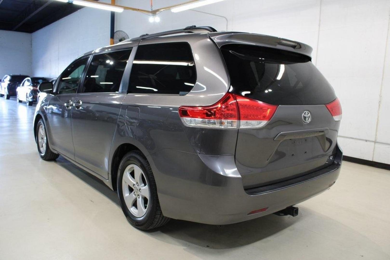 2014 Predawn Gray Mica /Light Gray Toyota Sienna LE (5TDKK3DC1ES) with an 3.5L V6 SMPI DOHC engine, Automatic transmission, located at 15300 Midway Rd., Addison, TX, 75001, (972) 702-0011, 32.958321, -96.838074 - HOME OF THE NO HAGGLE PRICE - WHOLESALE PRICES TO THE PUBLIC!! Sienna LE 8 Passenger, 4D Passenger Van, 3.5L V6 SMPI DOHC, 6-Speed Automatic Electronic with Overdrive, FWD, Gray, Light Gray Cloth.<br><br>Gray 2014 Toyota Sienna LE<br><br><br>Awards:<br> * 2014 KBB.com 12 Best Family Cars * 2014 K - Photo#3