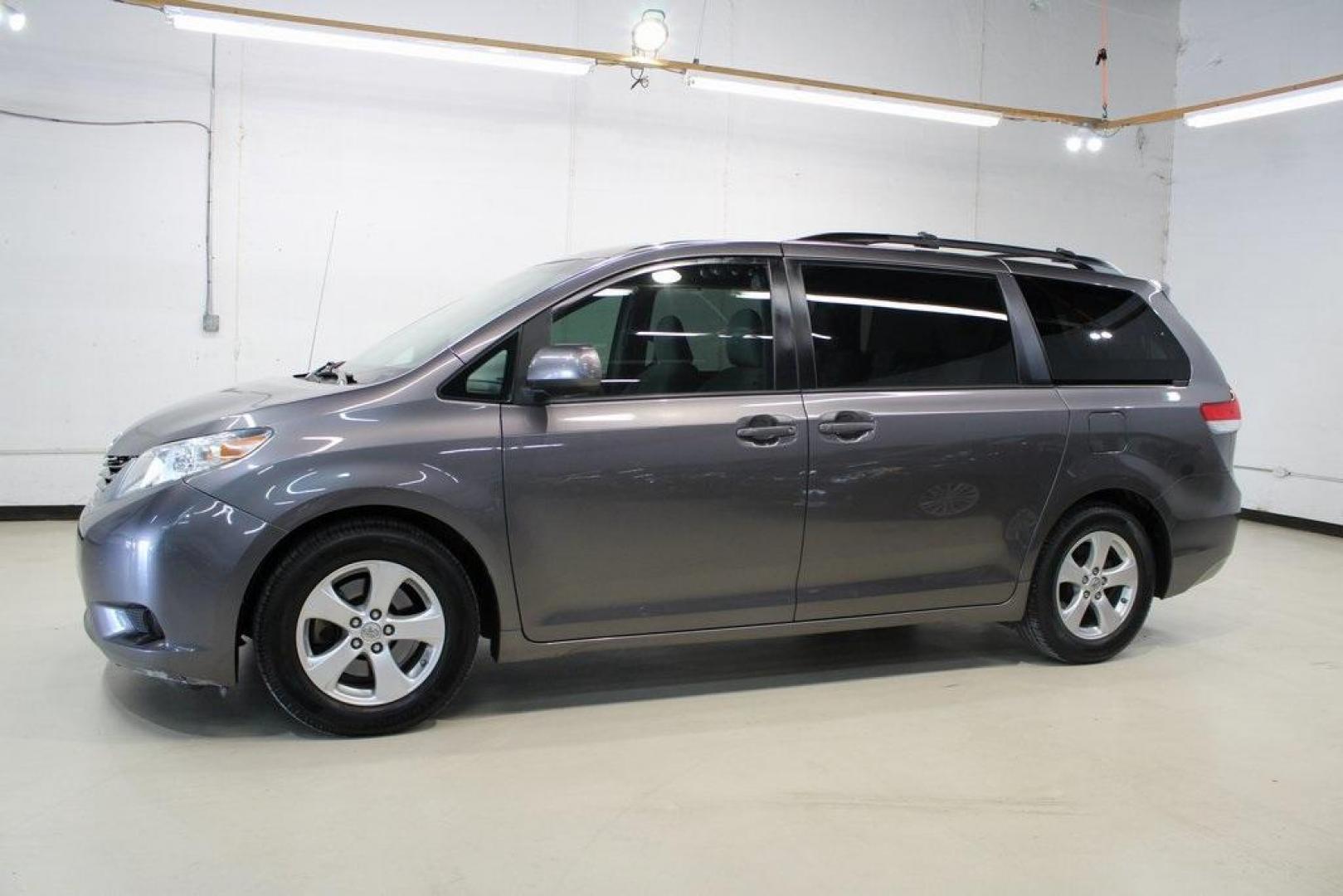 2014 Predawn Gray Mica /Light Gray Toyota Sienna LE (5TDKK3DC1ES) with an 3.5L V6 SMPI DOHC engine, Automatic transmission, located at 15300 Midway Rd., Addison, TX, 75001, (972) 702-0011, 32.958321, -96.838074 - HOME OF THE NO HAGGLE PRICE - WHOLESALE PRICES TO THE PUBLIC!! Sienna LE 8 Passenger, 4D Passenger Van, 3.5L V6 SMPI DOHC, 6-Speed Automatic Electronic with Overdrive, FWD, Gray, Light Gray Cloth.<br><br>Gray 2014 Toyota Sienna LE<br><br><br>Awards:<br> * 2014 KBB.com 12 Best Family Cars * 2014 K - Photo#4