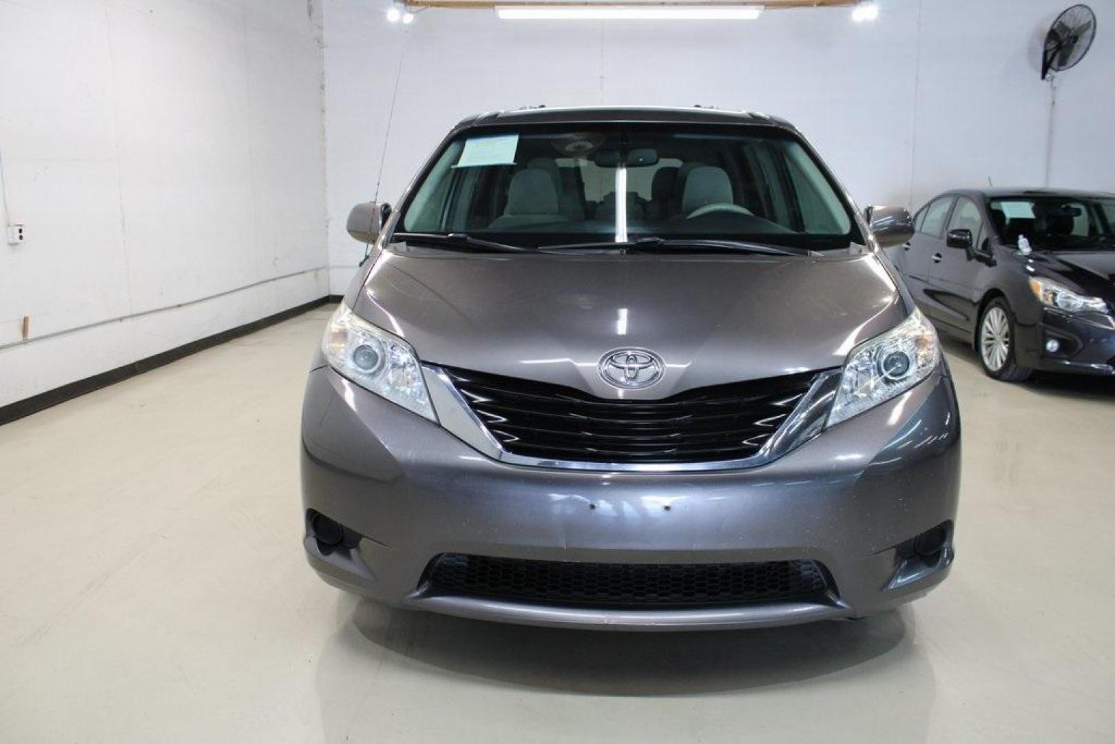 2014 Predawn Gray Mica /Light Gray Toyota Sienna LE (5TDKK3DC1ES) with an 3.5L V6 SMPI DOHC engine, Automatic transmission, located at 15300 Midway Rd., Addison, TX, 75001, (972) 702-0011, 32.958321, -96.838074 - HOME OF THE NO HAGGLE PRICE - WHOLESALE PRICES TO THE PUBLIC!! Sienna LE 8 Passenger, 4D Passenger Van, 3.5L V6 SMPI DOHC, 6-Speed Automatic Electronic with Overdrive, FWD, Gray, Light Gray Cloth.<br><br>Gray 2014 Toyota Sienna LE<br><br><br>Awards:<br> * 2014 KBB.com 12 Best Family Cars * 2014 K - Photo#5