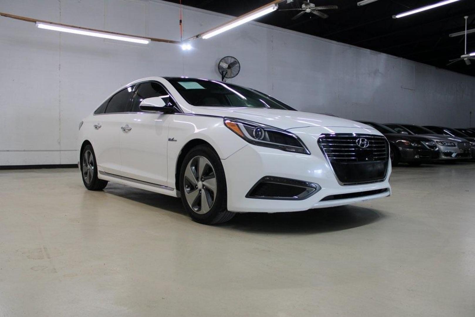 2016 Diamond White Pearl /Gray Hyundai Sonata Hybrid Limited (KMHE34L11GA) with an 2.0L I4 DGI Hybrid DOHC 16V SULEV II engine, Automatic transmission, located at 15300 Midway Rd., Addison, TX, 75001, (972) 702-0011, 32.958321, -96.838074 - Photo#1