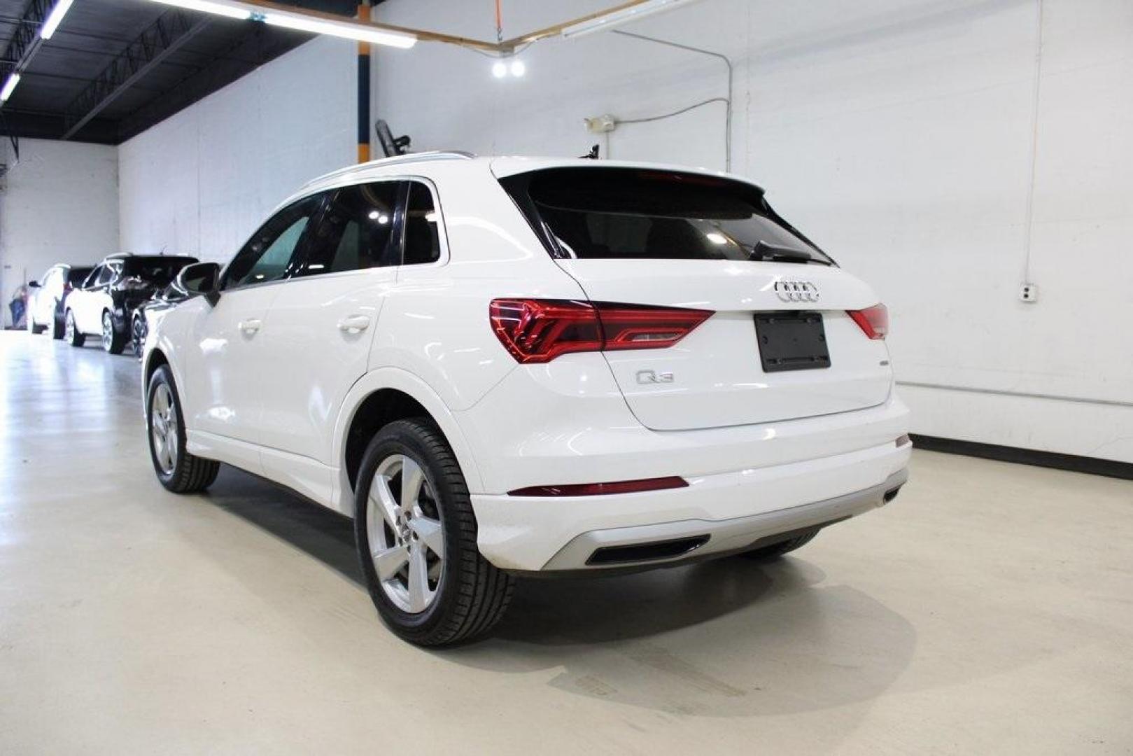 2020 White /Black Audi Q3 Premium (WA1AECF34L1) with an 2.0L 4-Cylinder TFSI engine, Automatic transmission, located at 15300 Midway Rd., Addison, TX, 75001, (972) 702-0011, 32.958321, -96.838074 - HOME OF THE NO HAGGLE PRICE - WHOLESALE PRICES TO THE PUBLIC!! Q3 Premium quattro, 4D Sport Utility, 2.0L 4-Cylinder TFSI, 8-Speed Automatic with Tiptronic, quattro, White, Leather.<br><br>White 2020 Audi Q3 Premium<br><br>19/27 City/Highway MPG<br><br>Awards:<br> * 2020 KBB.com Best Buy Awards<br> - Photo#3