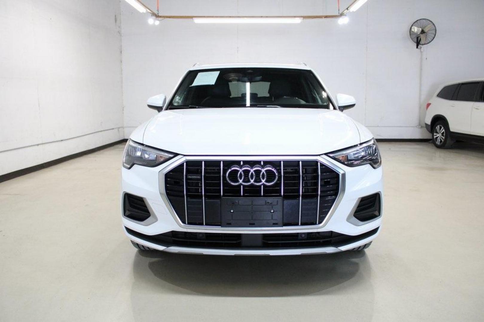 2020 White /Black Audi Q3 Premium (WA1AECF34L1) with an 2.0L 4-Cylinder TFSI engine, Automatic transmission, located at 15300 Midway Rd., Addison, TX, 75001, (972) 702-0011, 32.958321, -96.838074 - HOME OF THE NO HAGGLE PRICE - WHOLESALE PRICES TO THE PUBLIC!! Q3 Premium quattro, 4D Sport Utility, 2.0L 4-Cylinder TFSI, 8-Speed Automatic with Tiptronic, quattro, White, Leather.<br><br>White 2020 Audi Q3 Premium<br><br>19/27 City/Highway MPG<br><br>Awards:<br> * 2020 KBB.com Best Buy Awards<br> - Photo#5