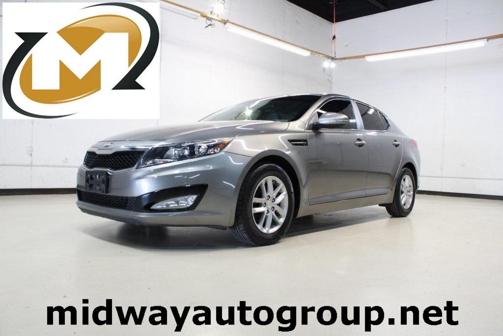 2013 Titanium Silver /Gray Kia Optima LX (5XXGM4A72DG) with an 2.4L I4 DGI DOHC engine, Automatic transmission, located at 15300 Midway Rd., Addison, TX, 75001, (972) 702-0011, 32.958321, -96.838074 - HOME OF THE NO HAGGLE PRICE - WHOLESALE PRICES TO THE PUBLIC!! Optima LX, 4D Sedan, 2.4L I4 DGI DOHC, 6-Speed Automatic with Sportmatic, FWD, Titanium Silver, Gray Cloth. Odometer is 23283 miles below market average!<br><br>Titanium Silver 2013 Kia Optima LX<br><br>Recent Arrival! 24/35 City/Highway - Photo#0