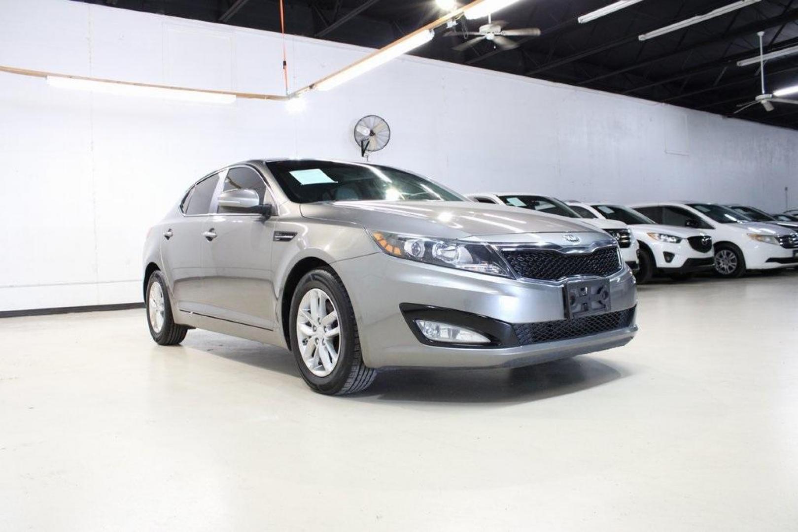 2013 Titanium Silver /Gray Kia Optima LX (5XXGM4A72DG) with an 2.4L I4 DGI DOHC engine, Automatic transmission, located at 15300 Midway Rd., Addison, TX, 75001, (972) 702-0011, 32.958321, -96.838074 - HOME OF THE NO HAGGLE PRICE - WHOLESALE PRICES TO THE PUBLIC!! Optima LX, 4D Sedan, 2.4L I4 DGI DOHC, 6-Speed Automatic with Sportmatic, FWD, Titanium Silver, Gray Cloth. Odometer is 23283 miles below market average!<br><br>Titanium Silver 2013 Kia Optima LX<br><br>Recent Arrival! 24/35 City/Highway - Photo#1