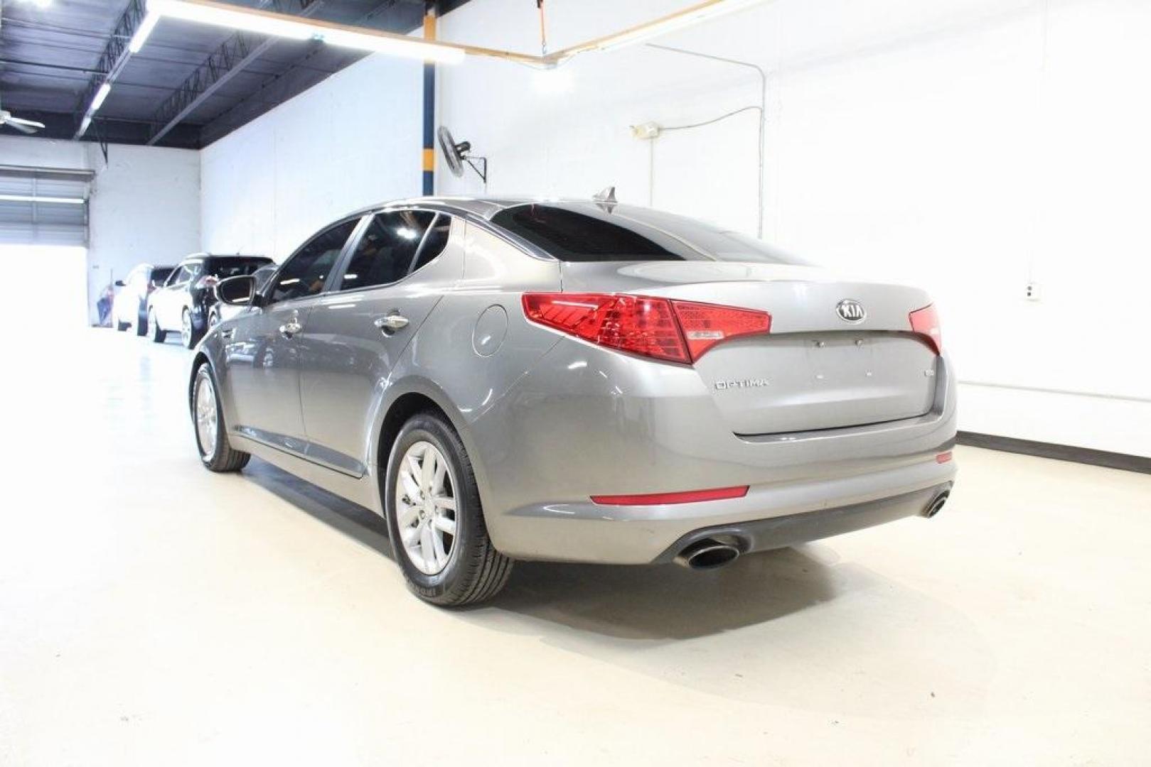 2013 Titanium Silver /Gray Kia Optima LX (5XXGM4A72DG) with an 2.4L I4 DGI DOHC engine, Automatic transmission, located at 15300 Midway Rd., Addison, TX, 75001, (972) 702-0011, 32.958321, -96.838074 - HOME OF THE NO HAGGLE PRICE - WHOLESALE PRICES TO THE PUBLIC!! Optima LX, 4D Sedan, 2.4L I4 DGI DOHC, 6-Speed Automatic with Sportmatic, FWD, Titanium Silver, Gray Cloth. Odometer is 23283 miles below market average!<br><br>Titanium Silver 2013 Kia Optima LX<br><br>Recent Arrival! 24/35 City/Highway - Photo#3