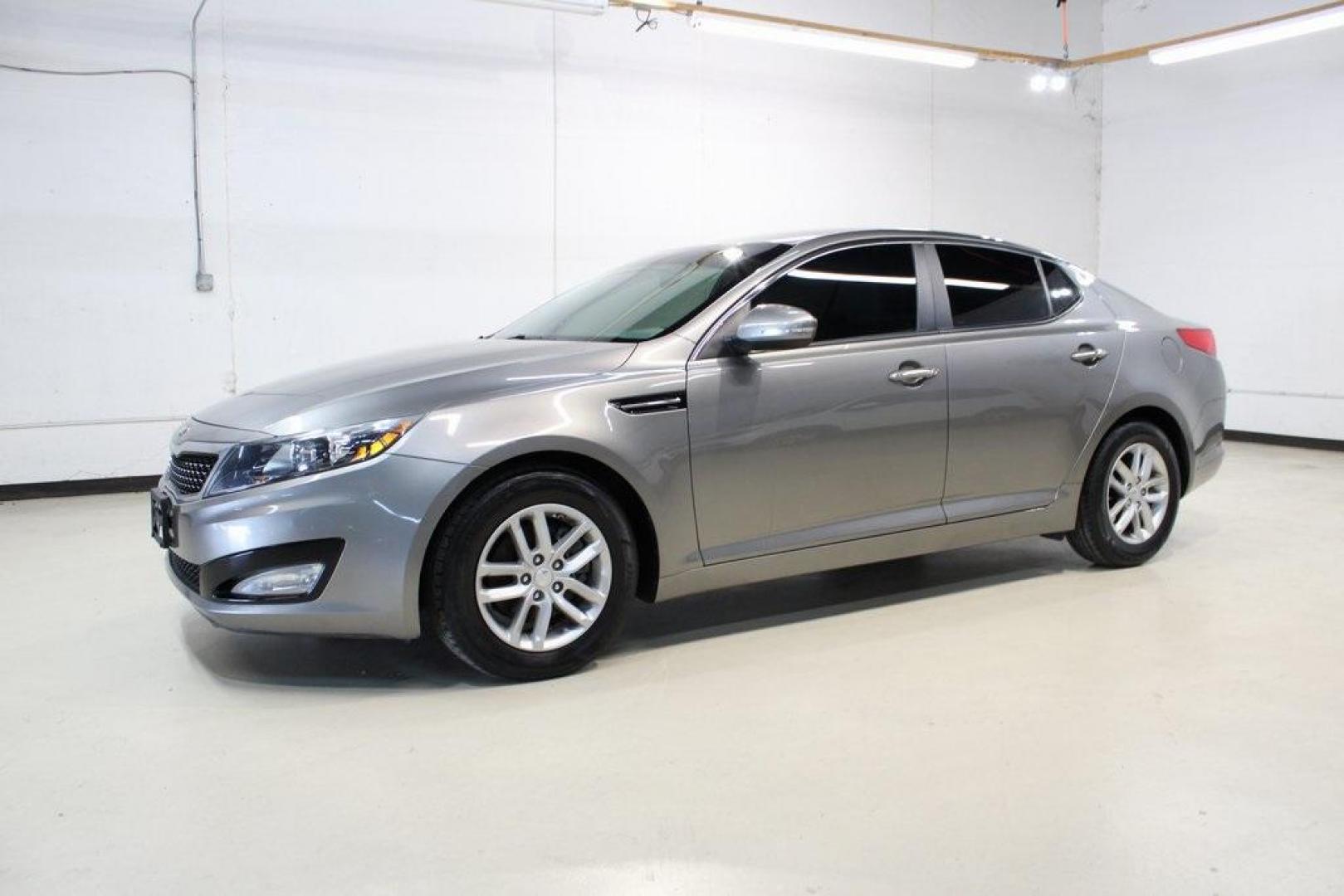 2013 Titanium Silver /Gray Kia Optima LX (5XXGM4A72DG) with an 2.4L I4 DGI DOHC engine, Automatic transmission, located at 15300 Midway Rd., Addison, TX, 75001, (972) 702-0011, 32.958321, -96.838074 - HOME OF THE NO HAGGLE PRICE - WHOLESALE PRICES TO THE PUBLIC!! Optima LX, 4D Sedan, 2.4L I4 DGI DOHC, 6-Speed Automatic with Sportmatic, FWD, Titanium Silver, Gray Cloth. Odometer is 23283 miles below market average!<br><br>Titanium Silver 2013 Kia Optima LX<br><br>Recent Arrival! 24/35 City/Highway - Photo#4