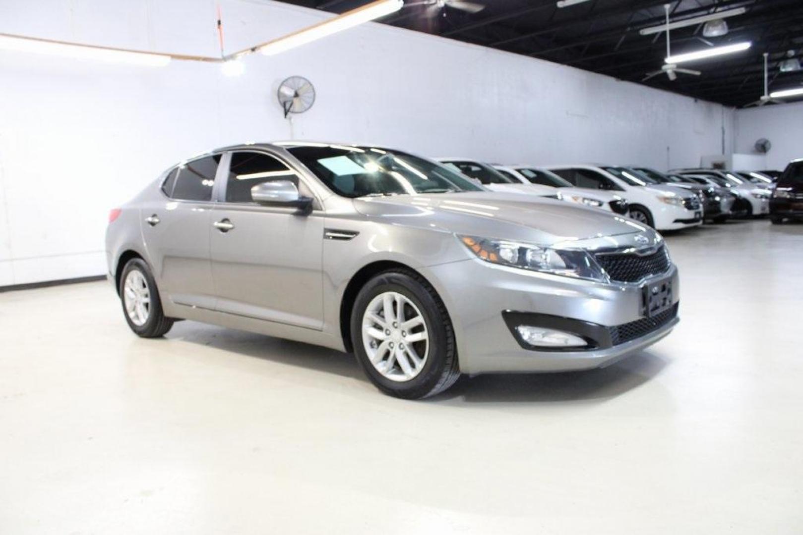 2013 Titanium Silver /Gray Kia Optima LX (5XXGM4A72DG) with an 2.4L I4 DGI DOHC engine, Automatic transmission, located at 15300 Midway Rd., Addison, TX, 75001, (972) 702-0011, 32.958321, -96.838074 - HOME OF THE NO HAGGLE PRICE - WHOLESALE PRICES TO THE PUBLIC!! Optima LX, 4D Sedan, 2.4L I4 DGI DOHC, 6-Speed Automatic with Sportmatic, FWD, Titanium Silver, Gray Cloth. Odometer is 23283 miles below market average!<br><br>Titanium Silver 2013 Kia Optima LX<br><br>Recent Arrival! 24/35 City/Highway - Photo#6