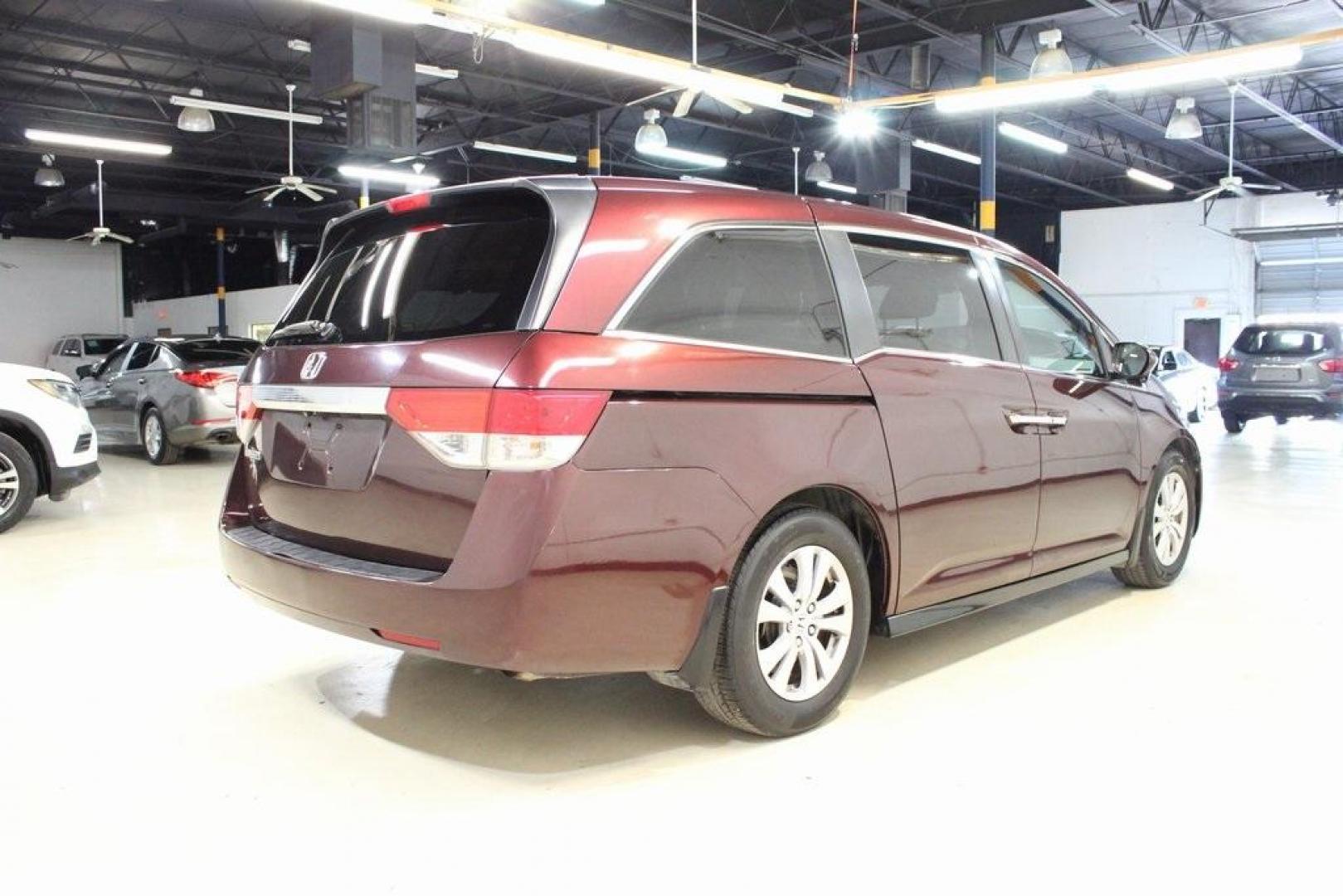 2015 Dark Cherry Pearl /Beige Honda Odyssey EX-L (5FNRL5H67FB) with an 3.5L V6 SOHC i-VTEC 24V engine, Automatic transmission, located at 15300 Midway Rd., Addison, TX, 75001, (972) 702-0011, 32.958321, -96.838074 - HOME OF THE NO HAGGLE PRICE - WHOLESALE PRICES TO THE PUBLIC!! Odyssey EX-L, 4D Passenger Van, 3.5L V6 SOHC i-VTEC 24V, 6-Speed Automatic, FWD, Burgundy, Leather. Priced below KBB Fair Purchase Price!<br><br>Burgundy 2015 Honda Odyssey EX-L<br><br>Recent Arrival! 19/28 City/Highway MPG<br><br>Awards - Photo#2