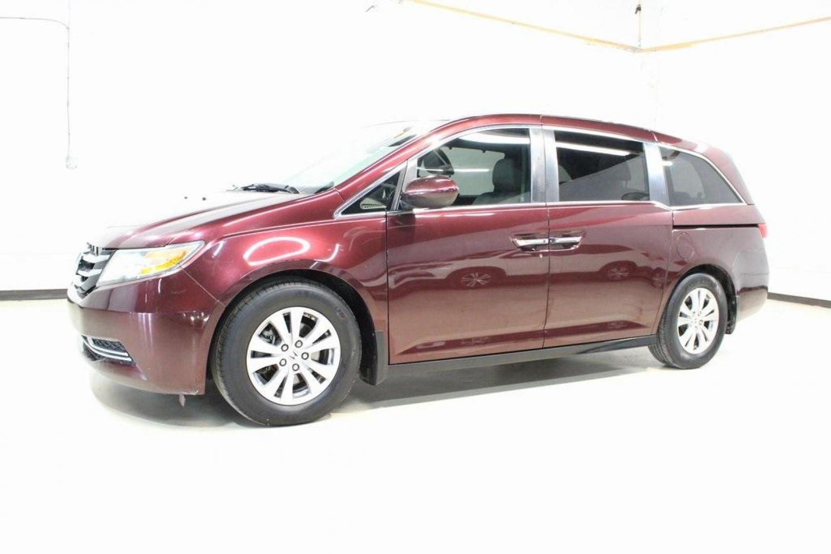 2015 Dark Cherry Pearl /Beige Honda Odyssey EX-L (5FNRL5H67FB) with an 3.5L V6 SOHC i-VTEC 24V engine, Automatic transmission, located at 15300 Midway Rd., Addison, TX, 75001, (972) 702-0011, 32.958321, -96.838074 - HOME OF THE NO HAGGLE PRICE - WHOLESALE PRICES TO THE PUBLIC!! Odyssey EX-L, 4D Passenger Van, 3.5L V6 SOHC i-VTEC 24V, 6-Speed Automatic, FWD, Burgundy, Leather. Priced below KBB Fair Purchase Price!<br><br>Burgundy 2015 Honda Odyssey EX-L<br><br>Recent Arrival! 19/28 City/Highway MPG<br><br>Awards - Photo#4