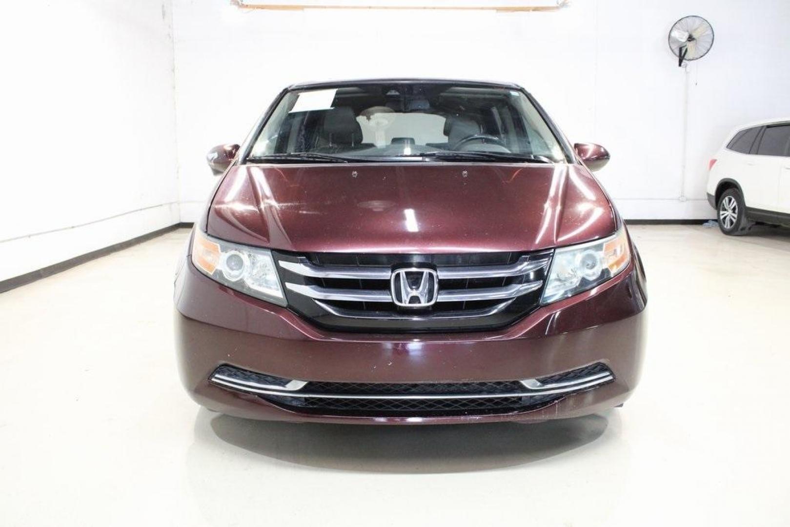 2015 Dark Cherry Pearl /Beige Honda Odyssey EX-L (5FNRL5H67FB) with an 3.5L V6 SOHC i-VTEC 24V engine, Automatic transmission, located at 15300 Midway Rd., Addison, TX, 75001, (972) 702-0011, 32.958321, -96.838074 - HOME OF THE NO HAGGLE PRICE - WHOLESALE PRICES TO THE PUBLIC!! Odyssey EX-L, 4D Passenger Van, 3.5L V6 SOHC i-VTEC 24V, 6-Speed Automatic, FWD, Burgundy, Leather. Priced below KBB Fair Purchase Price!<br><br>Burgundy 2015 Honda Odyssey EX-L<br><br>Recent Arrival! 19/28 City/Highway MPG<br><br>Awards - Photo#5