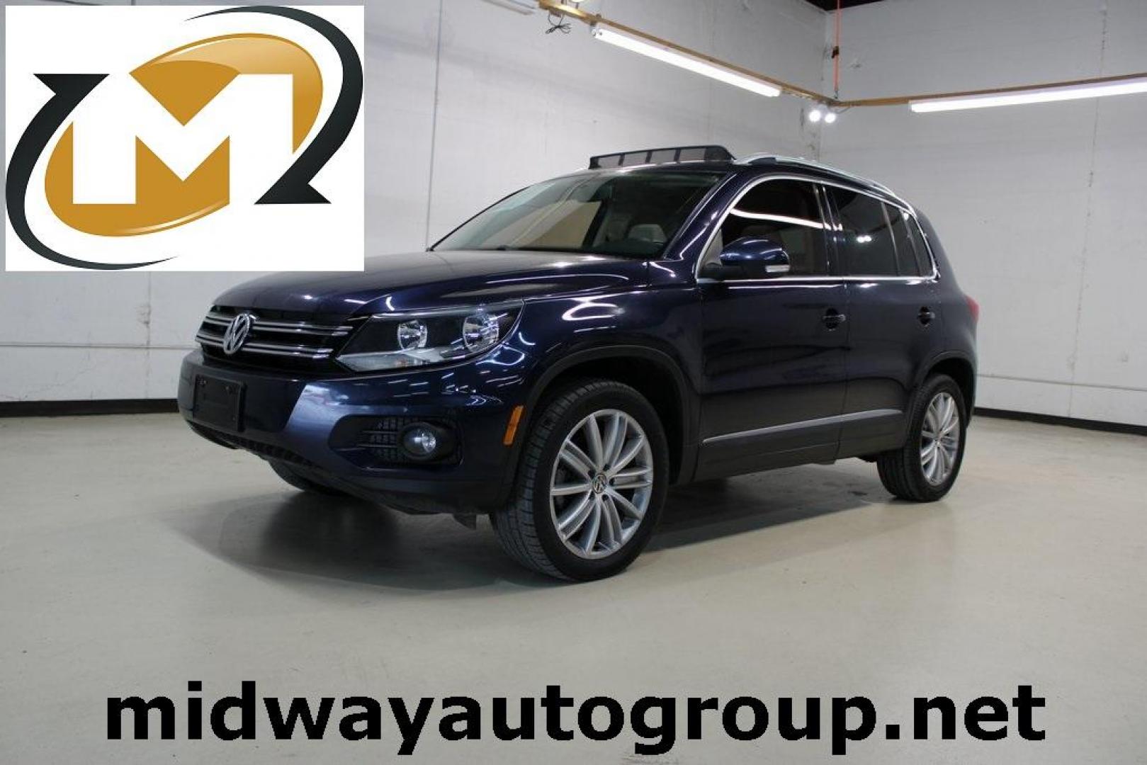 2015 Night Blue Metallic /Beige Volkswagen Tiguan SEL (WVGAV7AX7FW) with an 2.0L 4-Cylinder Turbocharged engine, Automatic transmission, located at 15300 Midway Rd., Addison, TX, 75001, (972) 702-0011, 32.958321, -96.838074 - HOME OF THE NO HAGGLE PRICE - WHOLESALE PRICES TO THE PUBLIC!! Tiguan SEL, 4D Sport Utility, 2.0L 4-Cylinder Turbocharged, 6-Speed Automatic with Tiptronic, FWD, Blue.<br><br>Blue 2015 Volkswagen Tiguan SEL<br><br>Recent Arrival! 21/26 City/Highway MPG<br><br><br>At Midway Auto Group, we strive to p - Photo#0