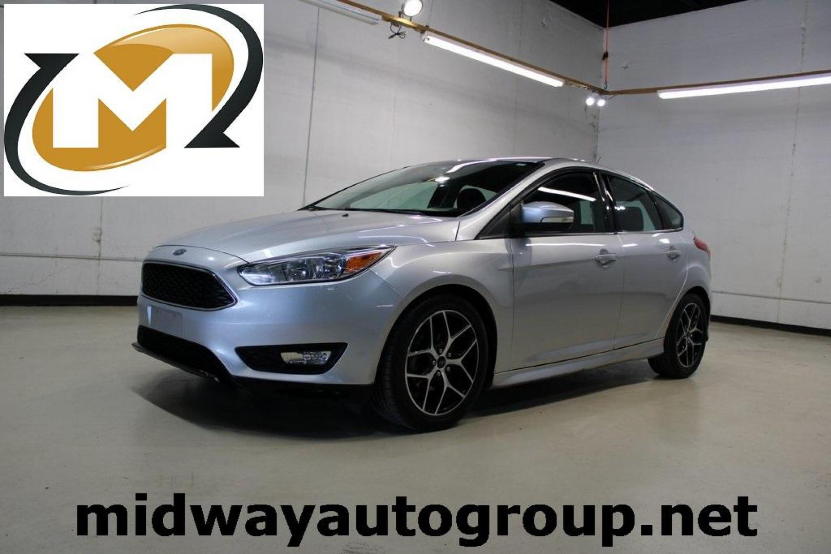 2016 Ingot Silver /Charcoal Ford Focus SE (1FADP3K21GL) with an 2.0L 4-Cylinder DGI DOHC engine, located at 15300 Midway Rd., Addison, TX, 75001, (972) 702-0011, 32.958321, -96.838074 - Photo#0