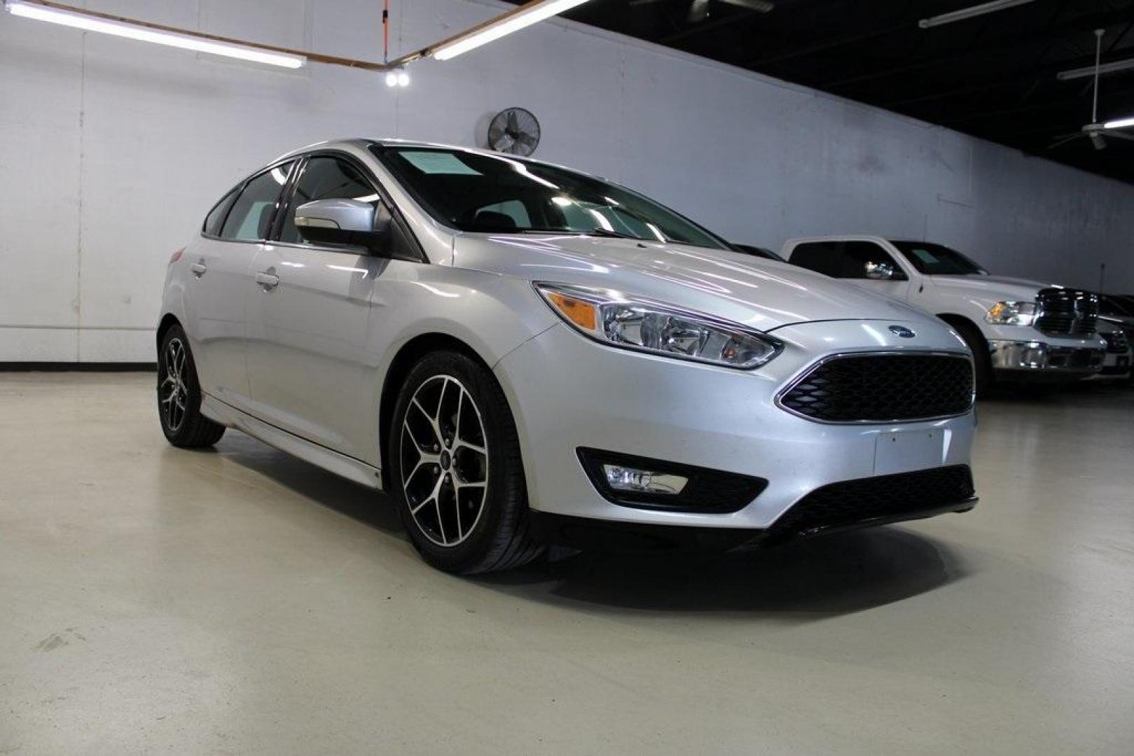 2016 Ingot Silver /Charcoal Ford Focus SE (1FADP3K21GL) with an 2.0L 4-Cylinder DGI DOHC engine, located at 15300 Midway Rd., Addison, TX, 75001, (972) 702-0011, 32.958321, -96.838074 - Photo#1