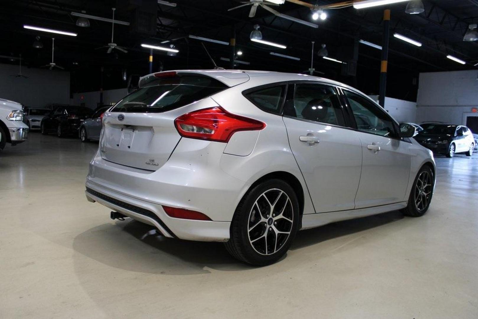 2016 Ingot Silver /Charcoal Ford Focus SE (1FADP3K21GL) with an 2.0L 4-Cylinder DGI DOHC engine, located at 15300 Midway Rd., Addison, TX, 75001, (972) 702-0011, 32.958321, -96.838074 - Photo#2