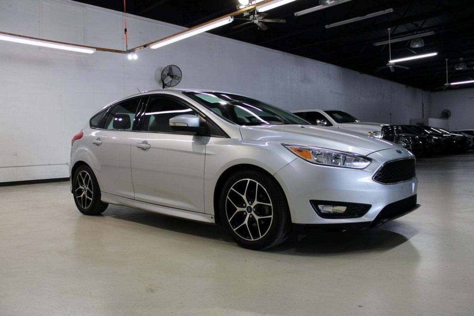 2016 Ingot Silver /Charcoal Ford Focus SE (1FADP3K21GL) with an 2.0L 4-Cylinder DGI DOHC engine, located at 15300 Midway Rd., Addison, TX, 75001, (972) 702-0011, 32.958321, -96.838074 - Photo#6