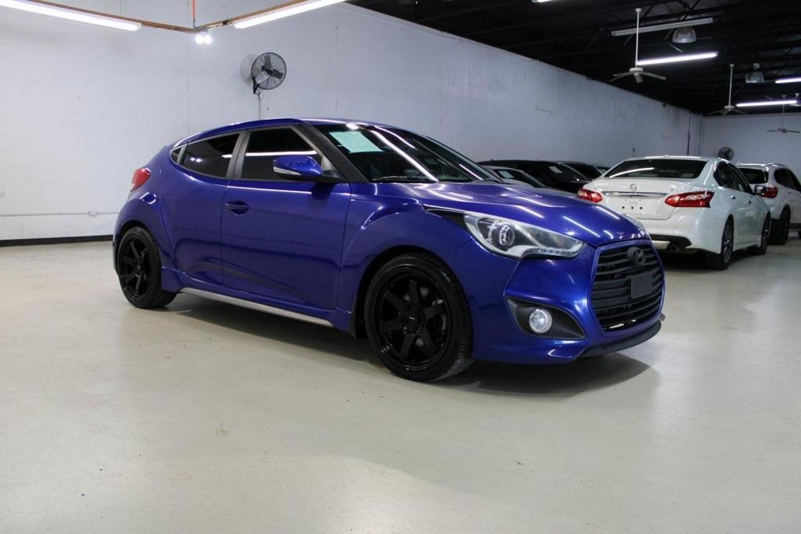 2014 Marathon Blue Pearl /Black Hyundai Veloster Turbo (KMHTC6AE7EU) with an 1.6L I4 DGI DOHC 16V Turbocharged engine, Manual transmission, located at 15300 Midway Rd., Addison, TX, 75001, (972) 702-0011, 32.958321, -96.838074 - HOME OF THE NO HAGGLE PRICE - WHOLESALE PRICES TO THE PUBLIC!! Veloster Turbo w/Black, 3D Hatchback, 1.6L I4 DGI DOHC 16V Turbocharged, 6-Speed Manual, FWD, Marathon Blue Pearl, Black Leather.<br><br>Marathon Blue Pearl 2014 Hyundai Veloster Turbo<br><br>Recent Arrival! 24/33 City/Highway MPG<br><br - Photo#6