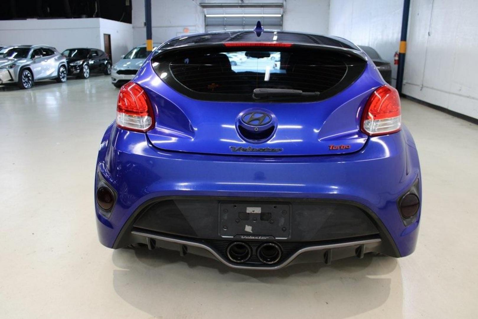 2014 Marathon Blue Pearl /Black Hyundai Veloster Turbo (KMHTC6AE7EU) with an 1.6L I4 DGI DOHC 16V Turbocharged engine, Manual transmission, located at 15300 Midway Rd., Addison, TX, 75001, (972) 702-0011, 32.958321, -96.838074 - HOME OF THE NO HAGGLE PRICE - WHOLESALE PRICES TO THE PUBLIC!! Veloster Turbo w/Black, 3D Hatchback, 1.6L I4 DGI DOHC 16V Turbocharged, 6-Speed Manual, FWD, Marathon Blue Pearl, Black Leather.<br><br>Marathon Blue Pearl 2014 Hyundai Veloster Turbo<br><br>Recent Arrival! 24/33 City/Highway MPG<br><br - Photo#7