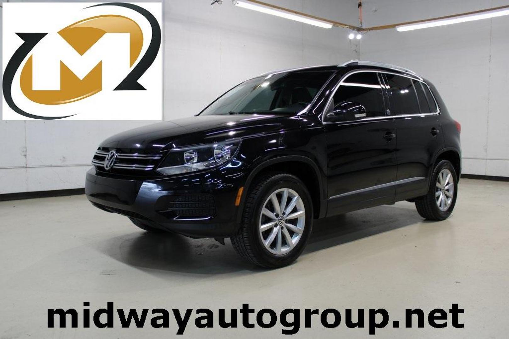 2017 Deep Black Pearl /Charcoal Black, Leat Volkswagen Tiguan Wolfsburg (WVGRV7AX4HW) with an 2.0L TSI DOHC engine, Automatic transmission, located at 15300 Midway Rd., Addison, TX, 75001, (972) 702-0011, 32.958321, -96.838074 - Photo#0