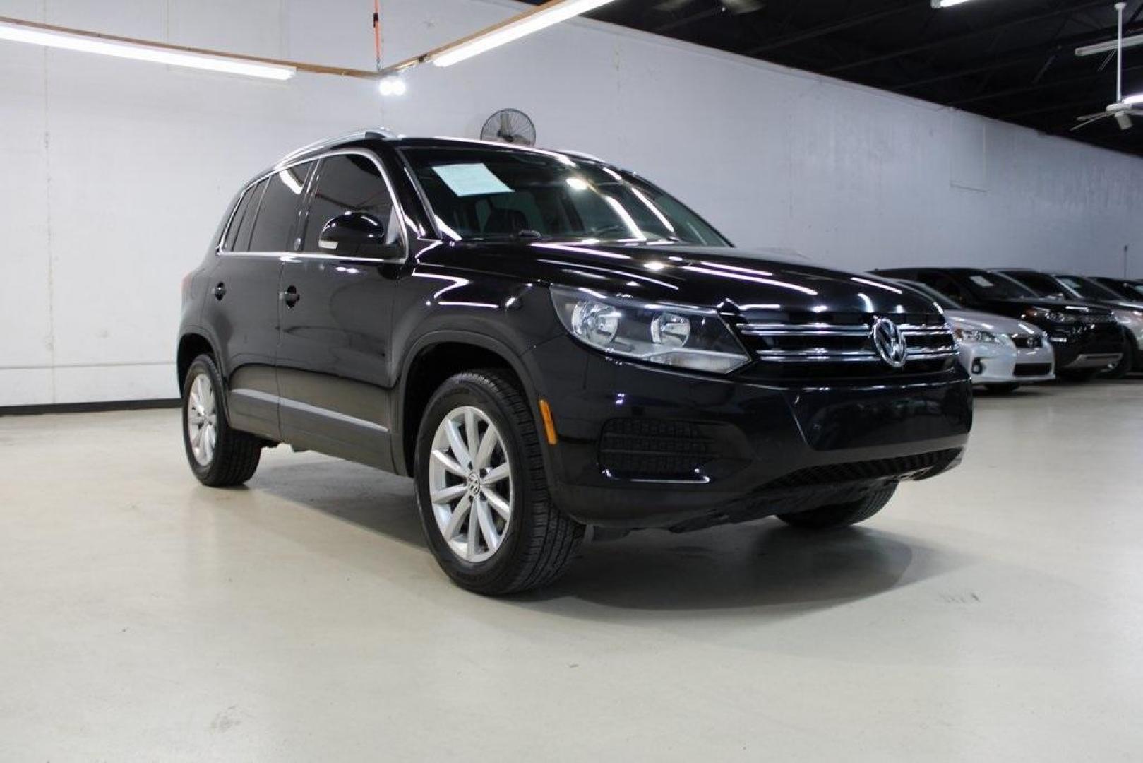 2017 Deep Black Pearl /Charcoal Black, Leat Volkswagen Tiguan Wolfsburg (WVGRV7AX4HW) with an 2.0L TSI DOHC engine, Automatic transmission, located at 15300 Midway Rd., Addison, TX, 75001, (972) 702-0011, 32.958321, -96.838074 - Photo#1