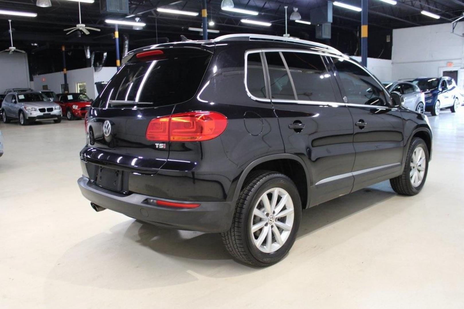 2017 Deep Black Pearl /Charcoal Black, Leat Volkswagen Tiguan Wolfsburg (WVGRV7AX4HW) with an 2.0L TSI DOHC engine, Automatic transmission, located at 15300 Midway Rd., Addison, TX, 75001, (972) 702-0011, 32.958321, -96.838074 - Photo#2